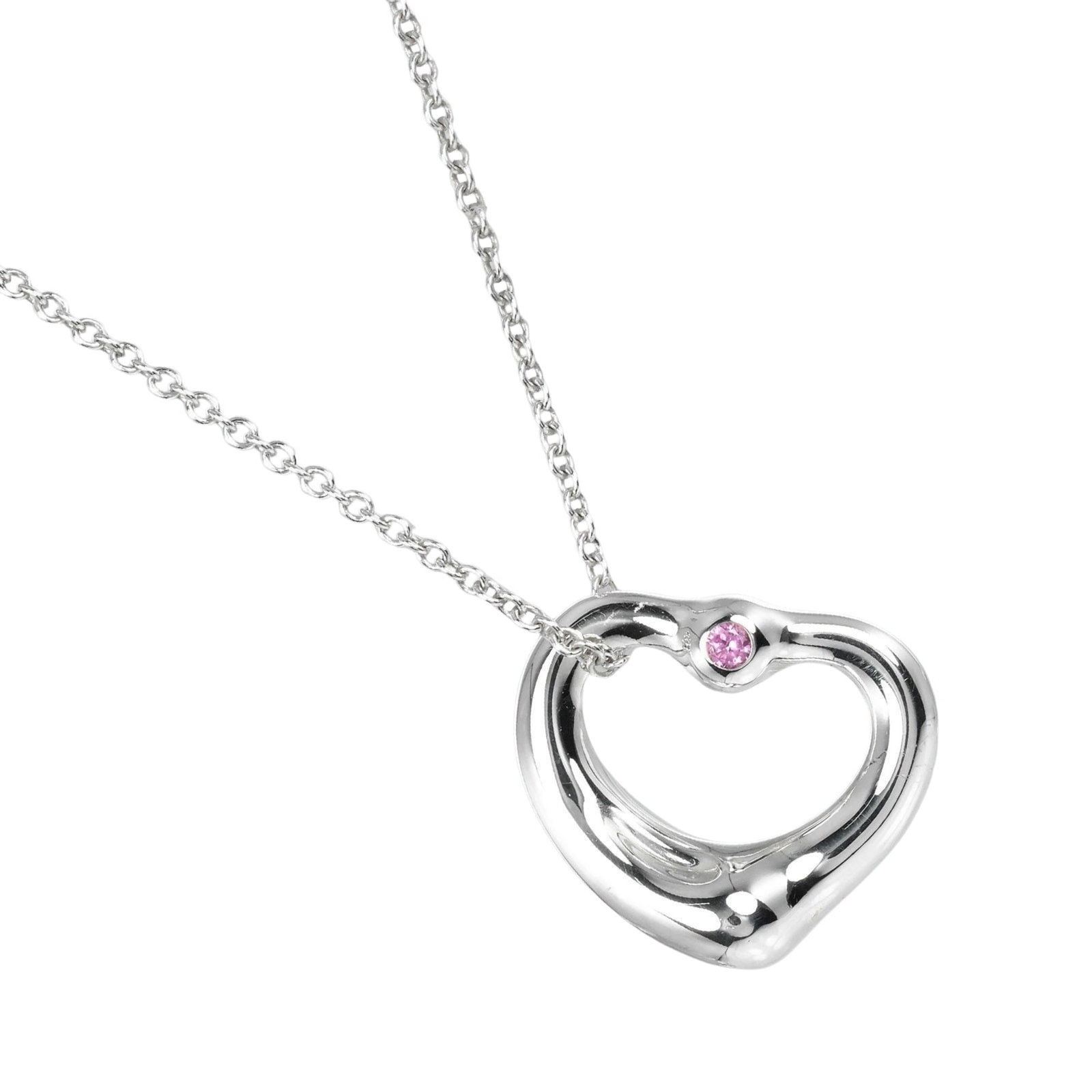 Tiffany & Co. Open Heart Necklace In 925 Sterling Silver With Pink Sapphire Approximately 3.5G: Tiffany & Co. Open Heart Necklace In 925 Sterling Silver With Pink Sapphire Approximately 3.5G Tiffany & Co. Open Heart Necklace in sterling silver with a pink sapphire pendant, featuring a classic