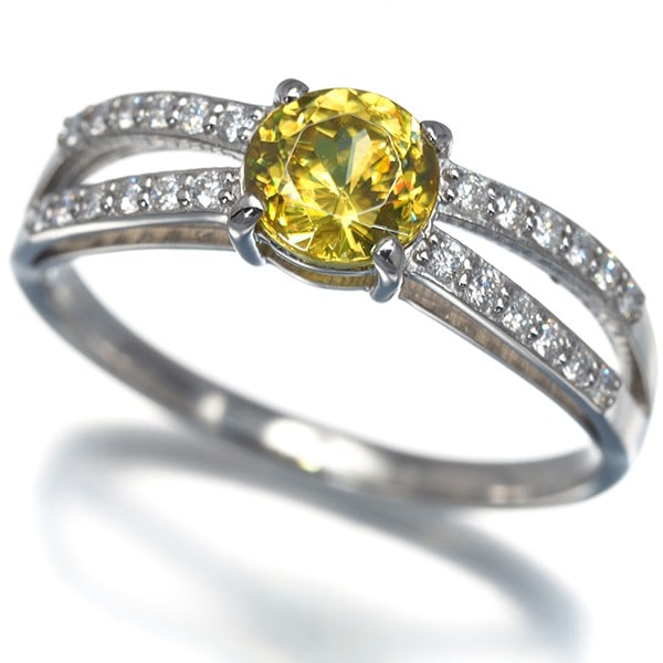 Sphene 0.87Ct Diamond 0.18Ct Ring 900 Platinum: Sphene 0.87Ct Diamond 0.18Ct Ring 900 Platinum 900 Platinum ring featuring a natural Sphene stone, approximately 5.7mm in diameter, accompanied by a total of 0.18ct diamond. The platinum metal purity