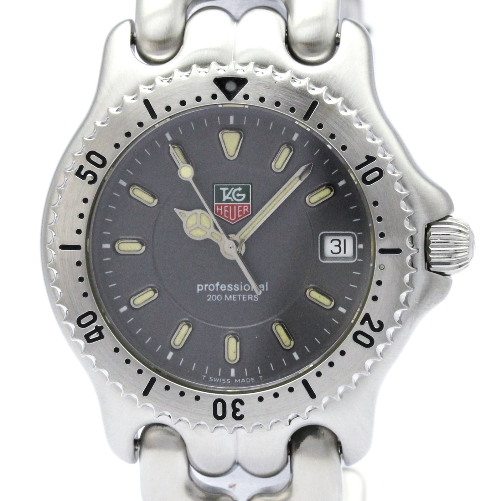 Wristwatch From Tag: Wristwatch From Tag Stainless steel case and band, the Tag Heuer WG1213 wristwatch boasts a sleek gray dial. With its quartz movement and date function, this timepiece offers practicality and style