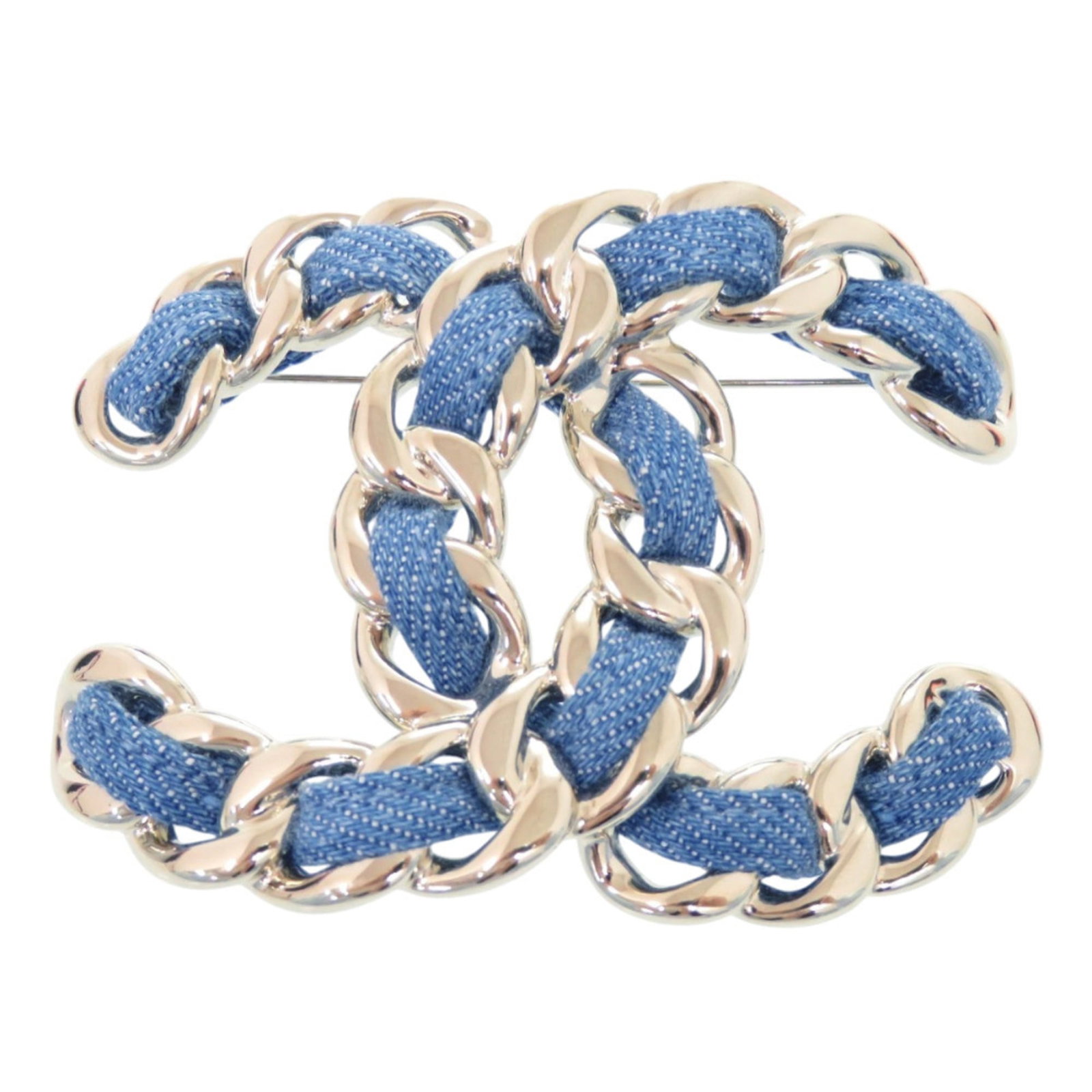 Metal Chanel Brooch: Metal Chanel Brooch Metal Chanel Brooch, Italy-made with a vibrant blue hue, measures 4cm x 5cm and features a sleek design. This brooch showcases the iconic Chanel style with its metal construction