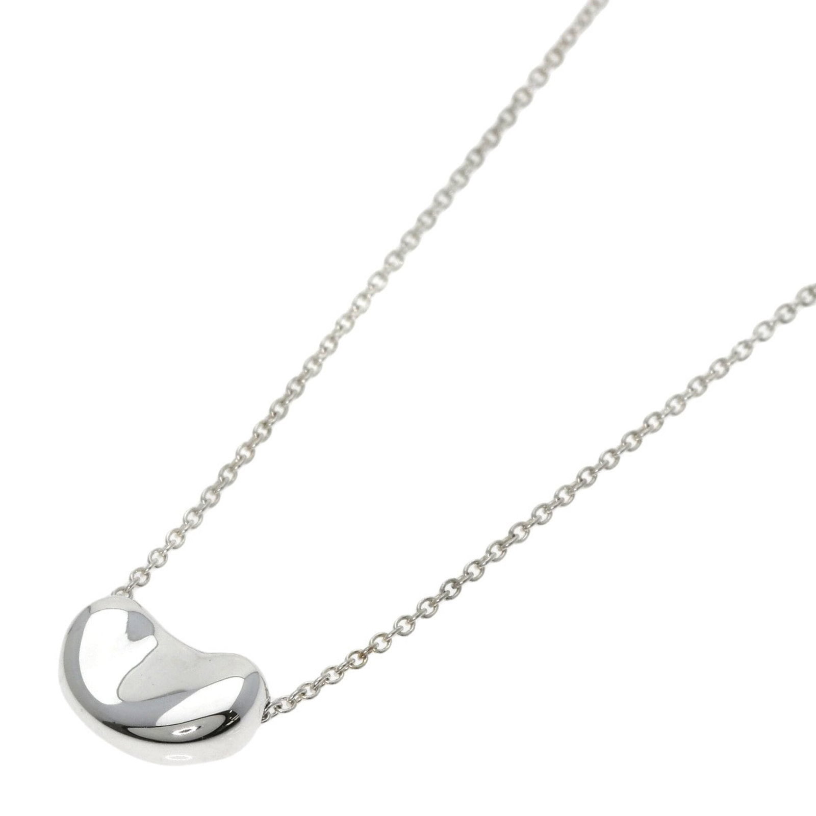 Women's silver Tiffany necklace by Tiffany & Co.: Women's silver Tiffany necklace by Tiffany & Co. Silver Tiffany necklace by Tiffany & Co. features a pendant with dimensions 7.7mm x 11.2mm and measures 43 cm in circumference, designed for women's