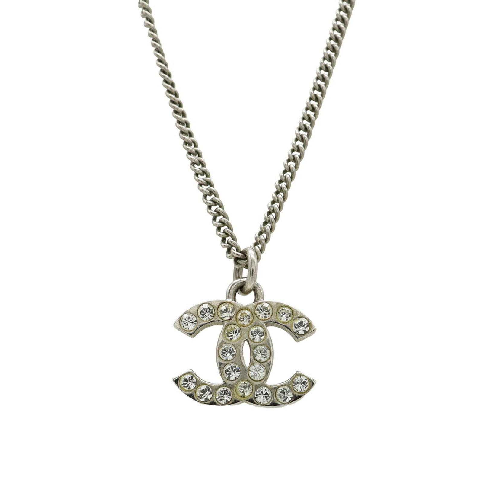 Coco Chanel Necklace Pendant Rhinestone Metal Silver F14: Coco Chanel Necklace Pendant Rhinestone Metal Silver F14 Silver Chanel necklace pendant featuring rhinestone accents, measuring 43 cm in circumference and 11mm x 15mm in size. The pendant's metallic