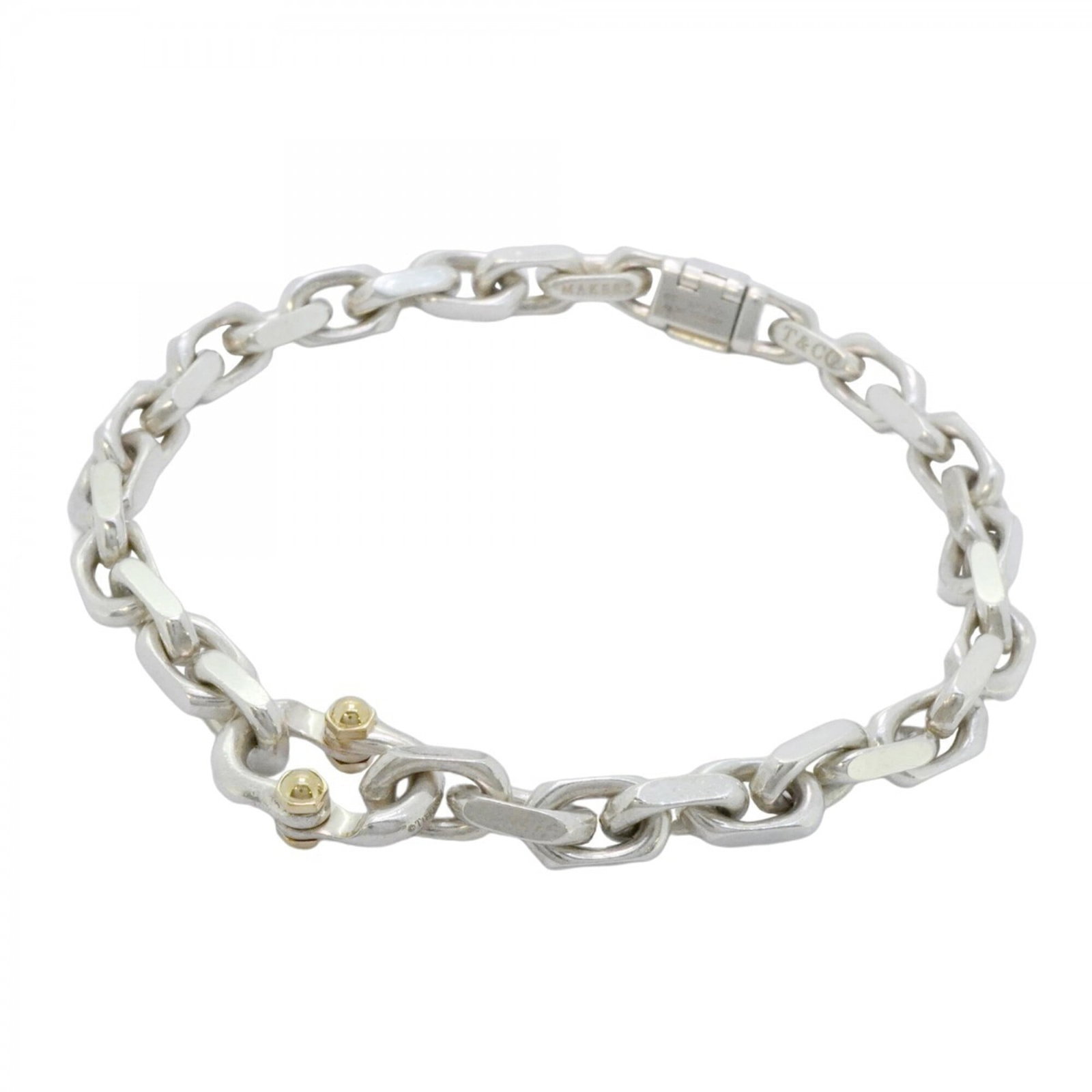 Charm Bracelet 925 Silver 18K Yellow Gold: Charm Bracelet 925 Silver 18K Yellow Gold Silver and 18K yellow gold combine in a timeless charm bracelet, available in a length of 17.5cm. This piece features the hallmark of Tiffany, adding an air o