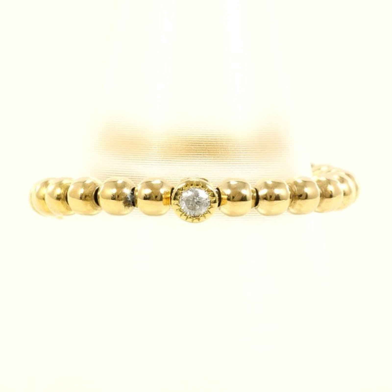 Unbranded Band Ring Yellow Gold (18K): Unbranded Band Ring Yellow Gold (18K) Yellow gold band ring with a 0.03ct diamond, crafted from 18K metal for a touch of elegance and sophistication. The ring's slender 5mm width and US size 6.5 fit