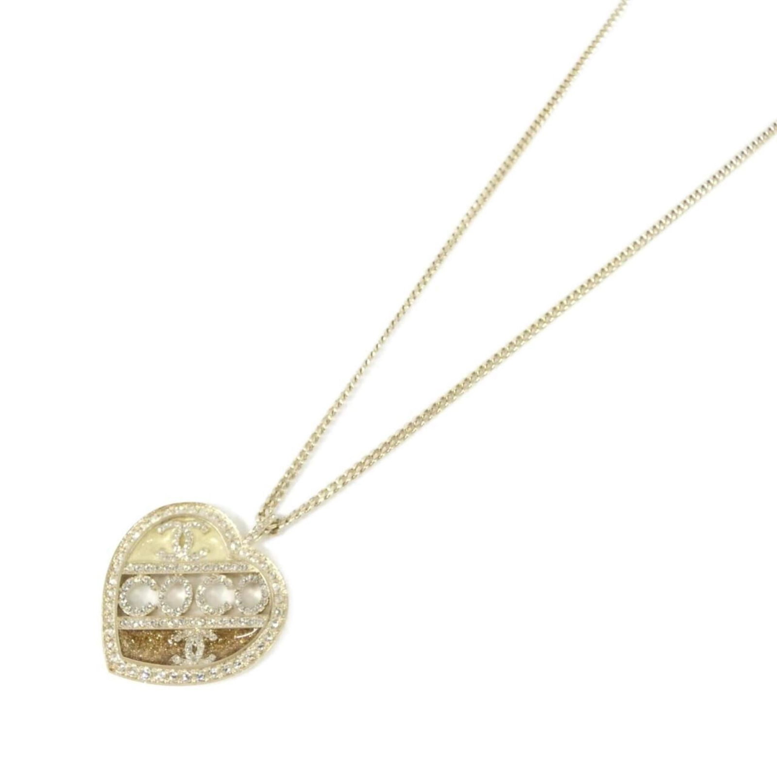 Chanel necklace Abb647: Chanel necklace Abb647 Gold and ivory Chanel necklace with a 40mm x 34mm pendant, suitable for neck circumferences ranging from 30.7'' to 33.26''. The necklace features a classic design with a 78 cm