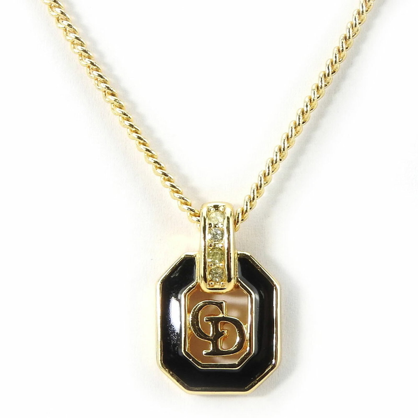 Women's black rhinestone gold metal necklace by Christian Dior: Women's black rhinestone gold metal necklace by Christian Dior Black rhinestone gold metal necklace by Christian Dior, featuring a striking 20.2mm x 13mm pendant set amidst a delicate chain with a