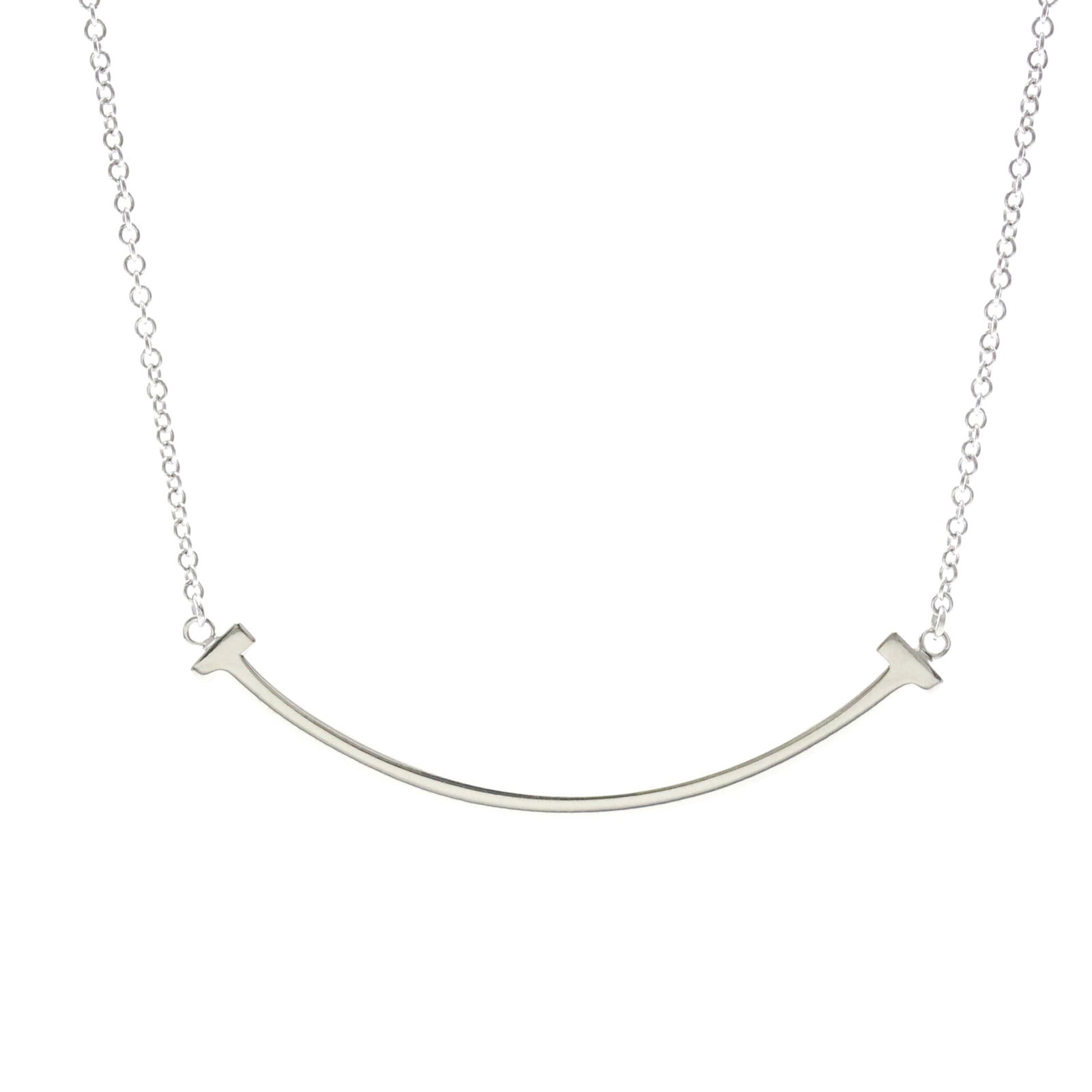 Tiffany T Smile Small Size Necklace White Gold (18K) No Stone Polished: Tiffany T Smile Small Size Necklace White Gold (18K) No Stone Polished Tiffany T Smile Small Size Necklace in White Gold (18K) - A sleek and modern accessory, this polished necklace features the iconi