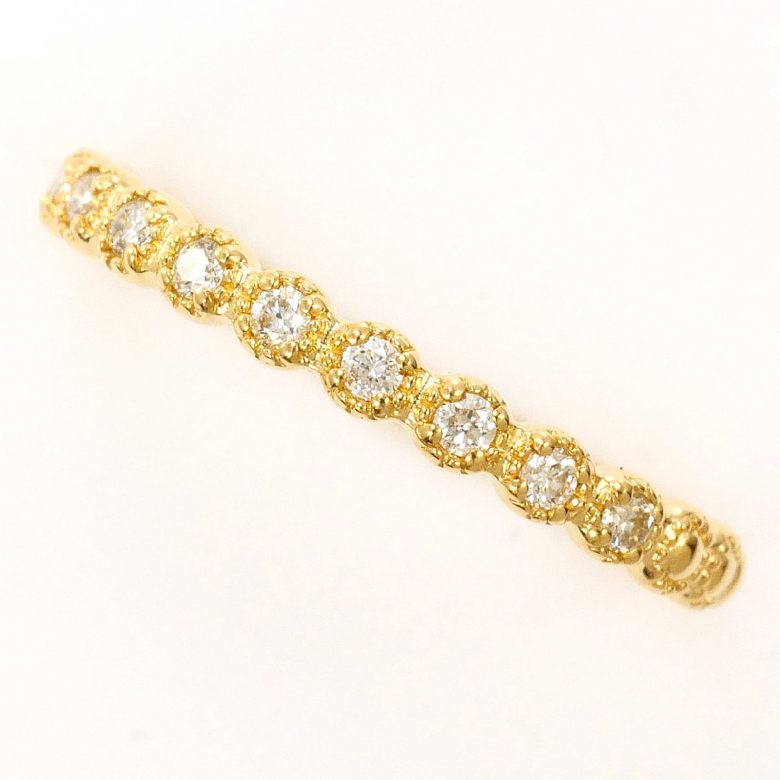 Unbranded Band Ring Yellow Gold (18K): Unbranded Band Ring Yellow Gold (18K) Yellow gold band ring with a 0.10ct diamond, crafted from 18K metal. This unbranded piece boasts a classic design and subtle shine, making it a simple yet