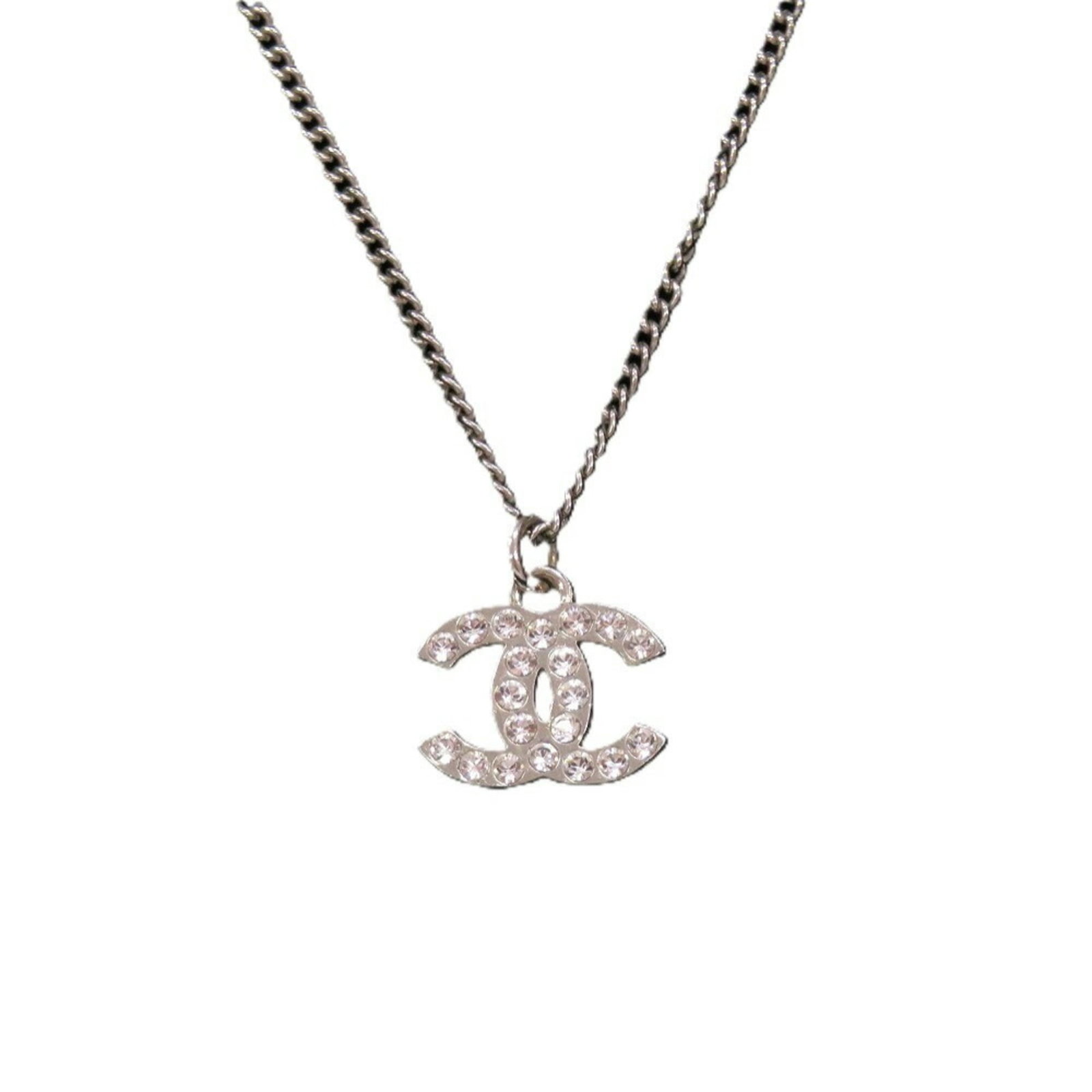 Coco Chanel Mark A28942 Silver Rhinestone Metal Necklace: Coco Chanel Mark A28942 Silver Rhinestone Metal Necklace Silver Rhinestone Metal Necklace with Box from Chanel, featuring a 43.5 cm / 17.12'' adjustable neck and a pendant measuring 11mm x 14mm. This