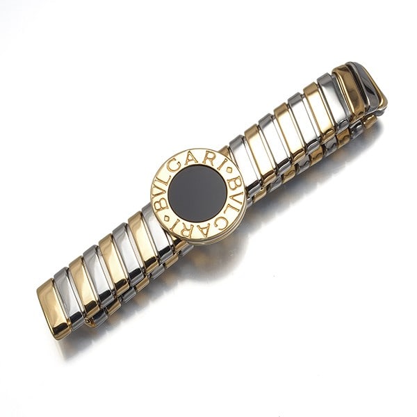 Bvlgari Tie Pin Onyx Tubogas 18K 750 Yellow Gold/ Stainless Steel: Bvlgari Tie Pin Onyx Tubogas 18K 750 Yellow Gold/ Stainless Steel Bvlgari's iconic Tie Pin Onyx Tubogas features a striking combination of 18k yellow gold and stainless steel, set with a natural onyx