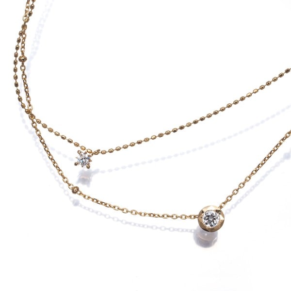 Diamond 0.15CT Pola Yellow Gold Layered 18K: Diamond 0.15CT Pola Yellow Gold Layered 18K 18k yellow gold layered with natural diamonds, this elegant pendant showcases two distinct stones. The larger diamond measures approximately 4.8mm in diamet