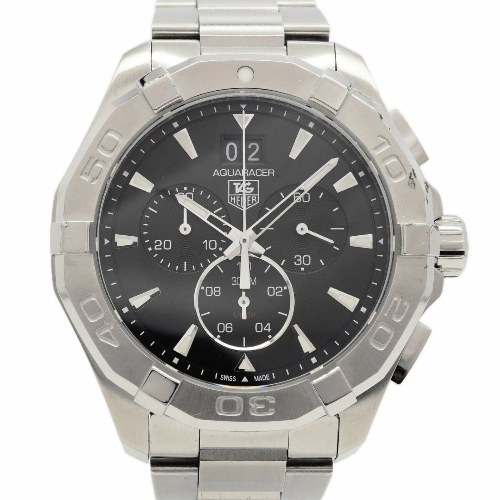 Wristwatch From Tag: Wristwatch From Tag Stainless steel band and black dial make for a sleek, modern look in this Tag Heuer wristwatch. The quartz movement ensures reliable timekeeping, while the 44.2mm case diameter
