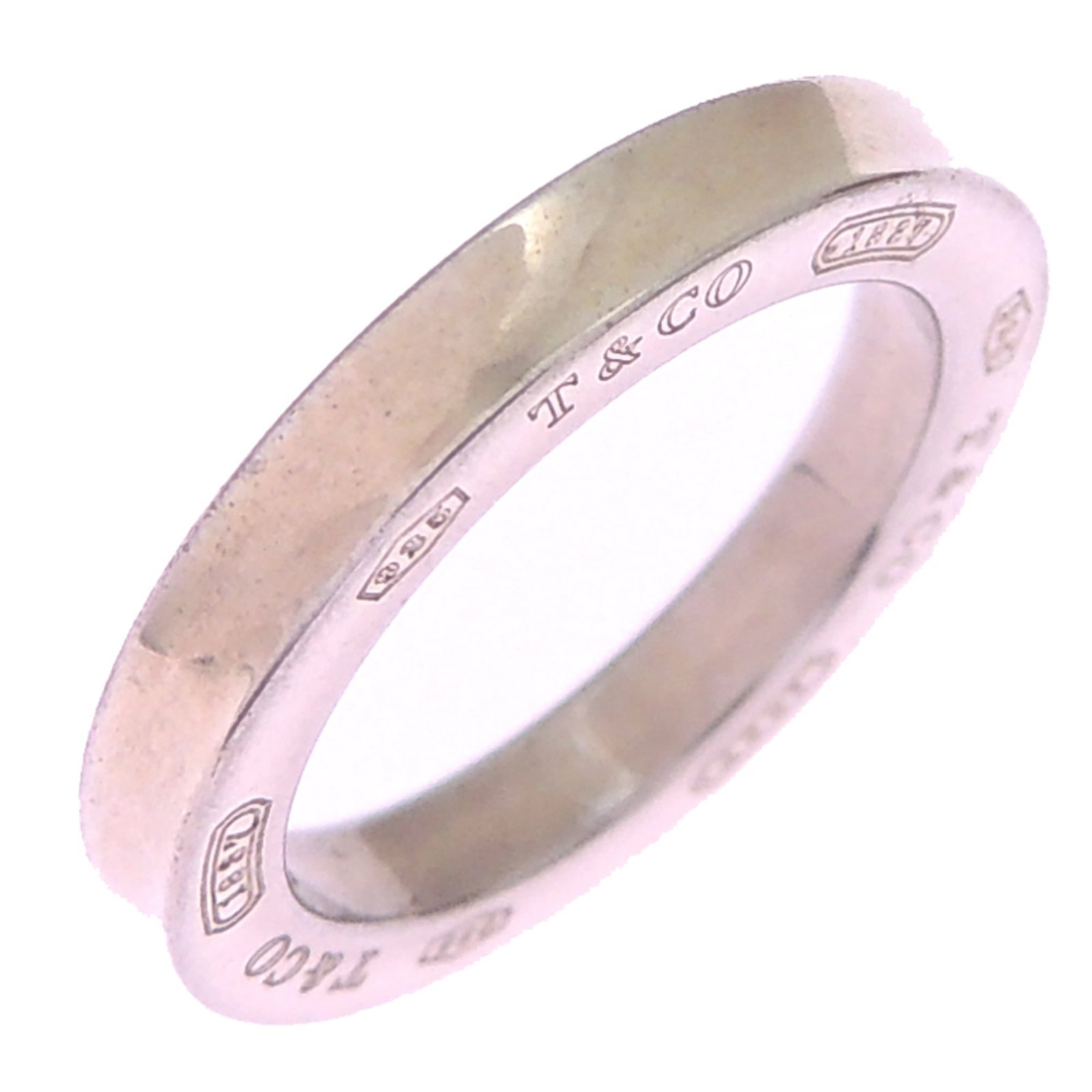 Silver 925 Tiffany Band Ring: Silver 925 Tiffany Band Ring Silver 925 Tiffany Band Ring, designed with elegant simplicity, features a premium silver material and a classic band style. This US Size 1 ring also fits the Japanese JP
