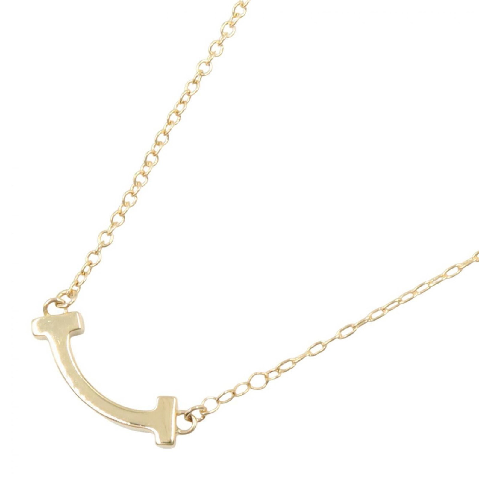 Tiffany & Co. T Smile Mini Necklace 18K (Yellow Gold) Women'S Gold Tone 62617640: Tiffany & Co. T Smile Mini Necklace 18K (Yellow Gold) Women'S Gold Tone 62617640 Tiffany & Co.'s T Smile Mini Necklace in 18K yellow gold is a delicate and elegant piece, featuring a 3mm x 13mm