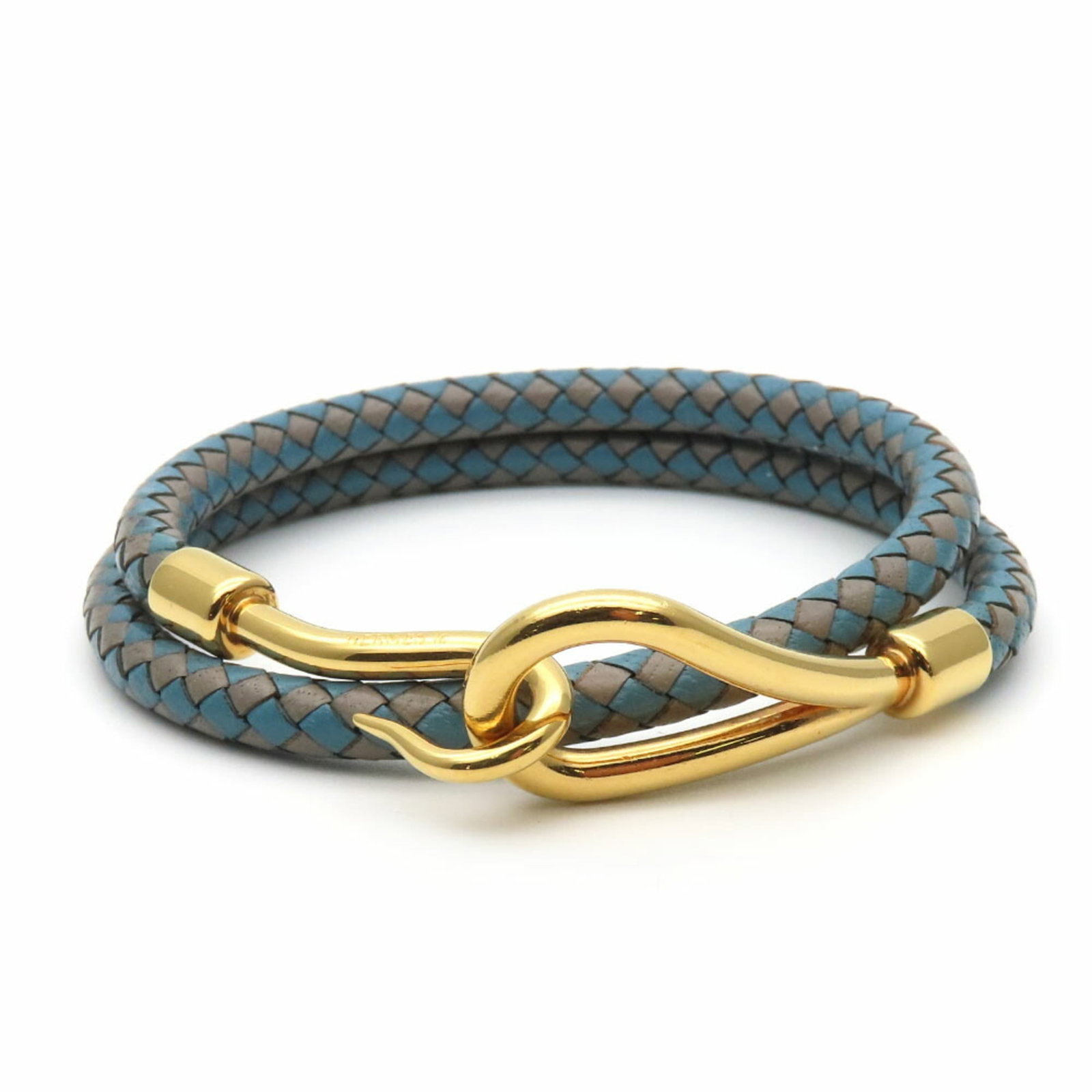 Metal leather bracelet charm by Hermes: Metal leather bracelet charm by Hermes Metal leather bracelet charm by Hermes features a striking blue and gray color combination. The charm's metal and leather construction provides a unique blend