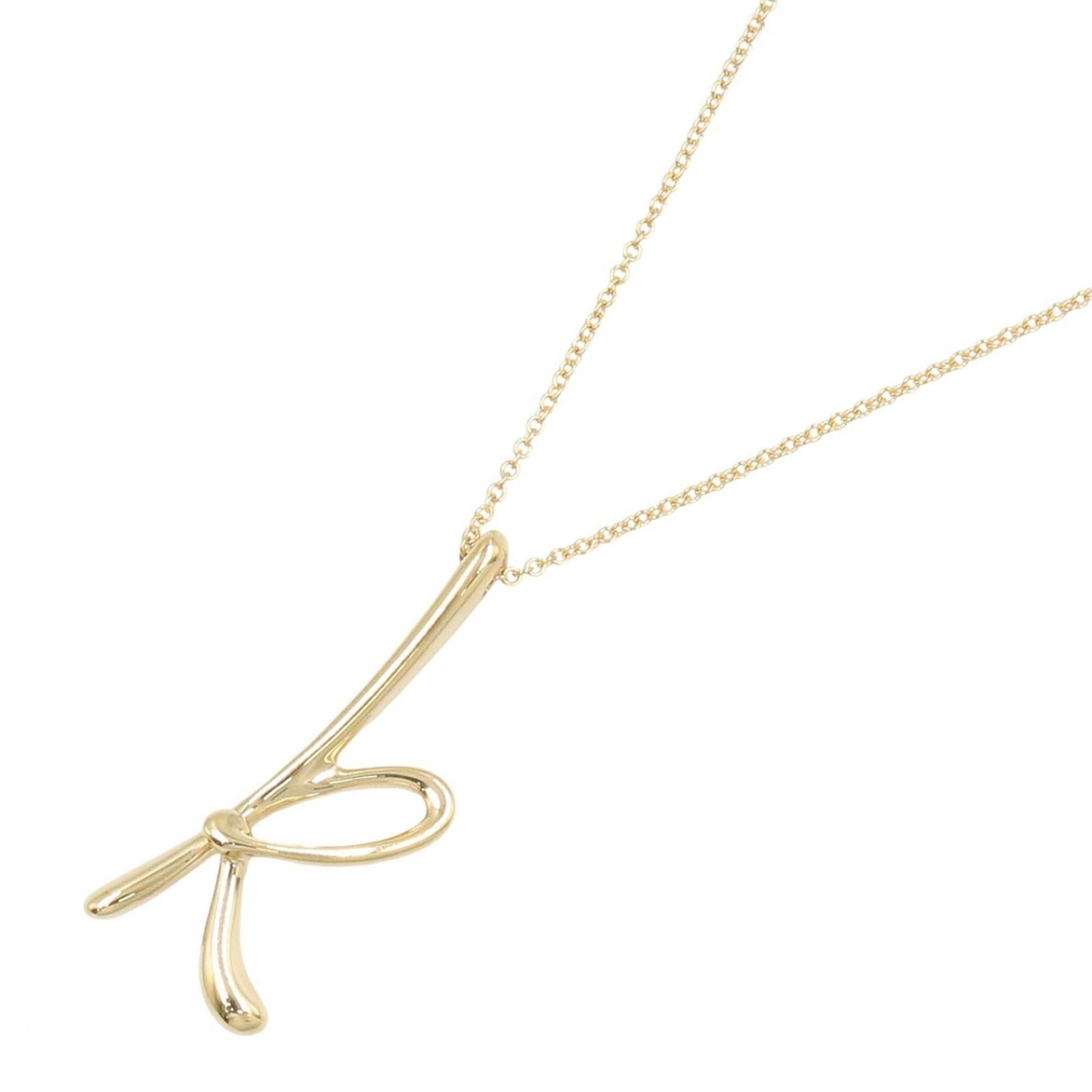 Tiffany & Co. Initial K Letter Necklace 18K (Yellow Gold) Women'S Jewelry Gold Tone: Tiffany & Co. Initial K Letter Necklace 18K (Yellow Gold) Women'S Jewelry Gold Tone Tiffany & Co.'s Initial K Letter Necklace in 18K yellow gold boasts a sleek design, featuring a 25mm x 10mm pendant.