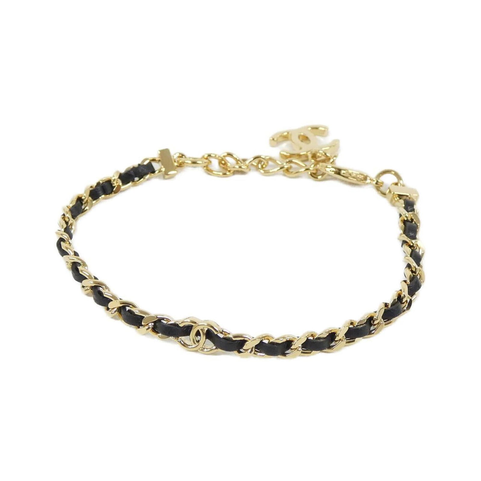Leather Charm Bracelet by Chanel: Leather Charm Bracelet by Chanel Black leather charm bracelet from Chanel, featuring lamb leather material and measuring 23cm in length. This classic design showcases the brand's signature style with