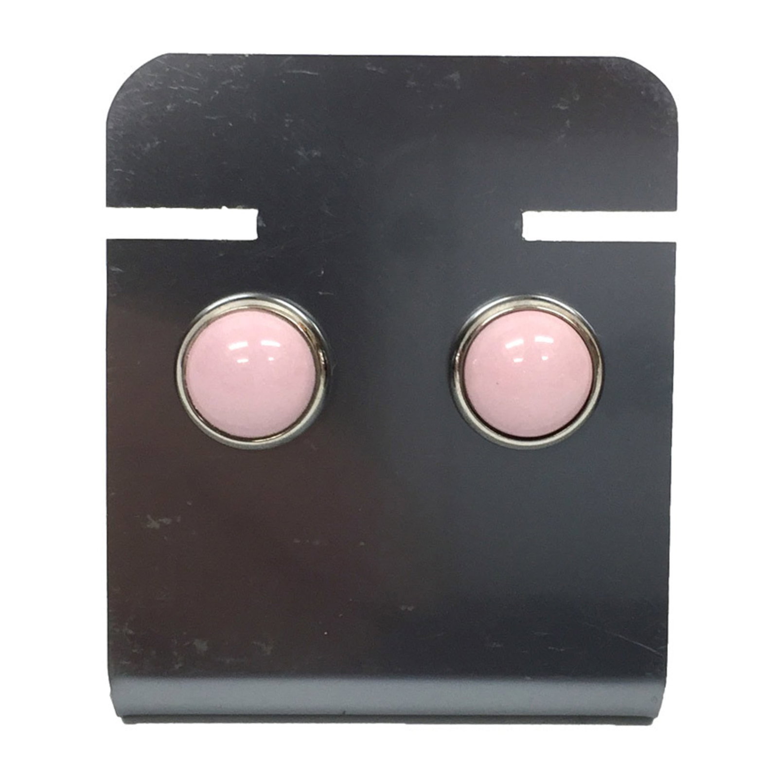 Brass stud earrings by Hermes: Brass stud earrings by Hermes Brass stud earrings by Hermes, available in pink and silver, come with a luxurious box for added elegance. The brass material adds a touch of sophistication to any
