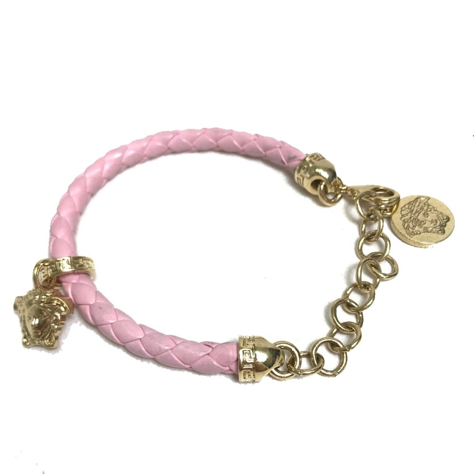 Versace Other Leather: Versace Other Leather This Versace Other Leather wristband boasts a striking pink hue and sleek design, featuring adjustable wrist circumference for a customizable fit. The band's slender width and