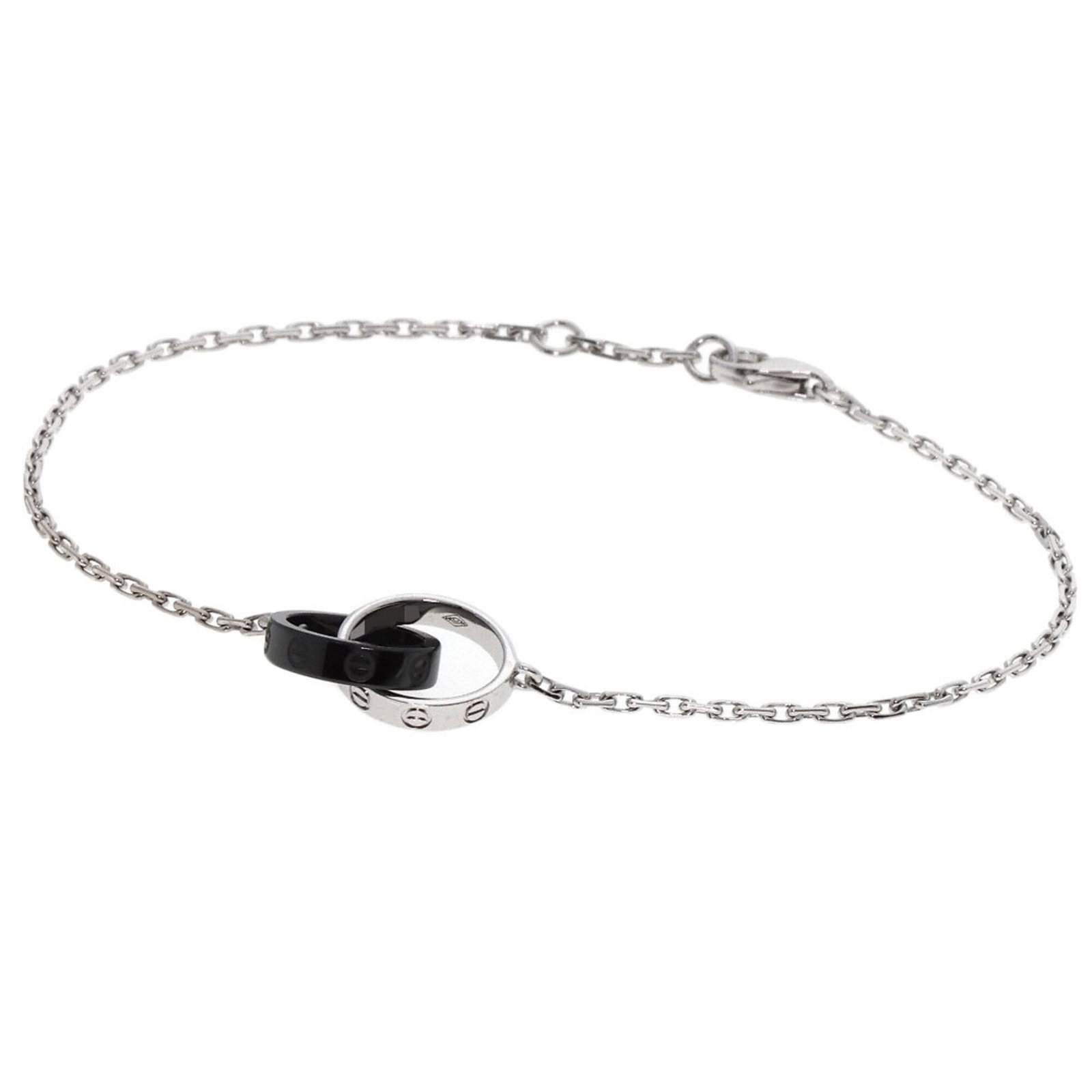 Ceramic White Gold Cartier Charm Bracelet: Ceramic White Gold Cartier Charm Bracelet Ceramic and white gold (18K) come together in this Cartier charm bracelet, featuring a unique blend of materials. The ceramic element adds a touch of modernit