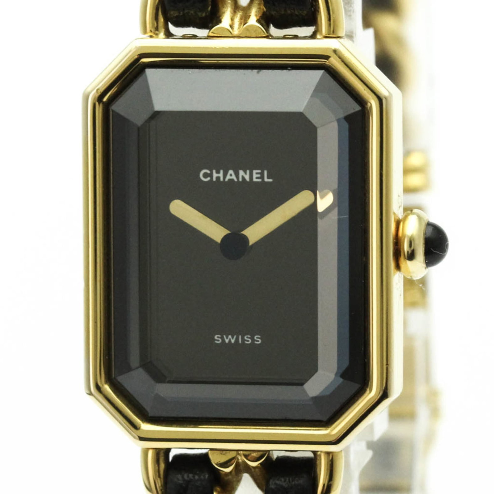 Chanel Wristwatch: Chanel Wristwatch Gold plated case and leather band add a touch of elegance to this sleek Chanel wristwatch, featuring a black dial and quartz movement. Weighing in at just 50g, this petite timepiece 