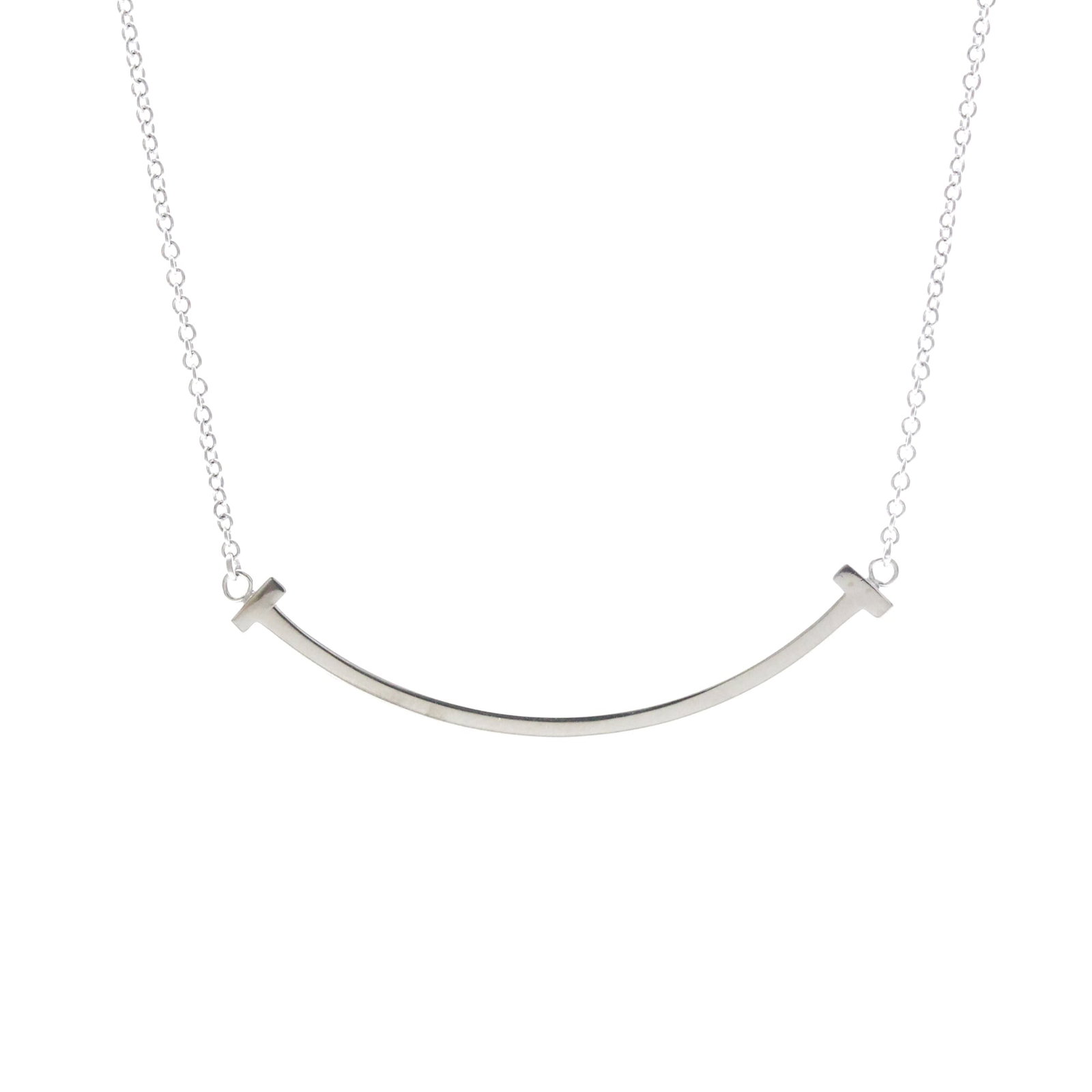 Tiffany T Smile Small Size Necklace White Gold (18K) No Stone Polished: Tiffany T Smile Small Size Necklace White Gold (18K) No Stone Polished Tiffany T Smile Small Size Necklace in White Gold. This stylish necklace features a sleek design with no stone, crafted from high