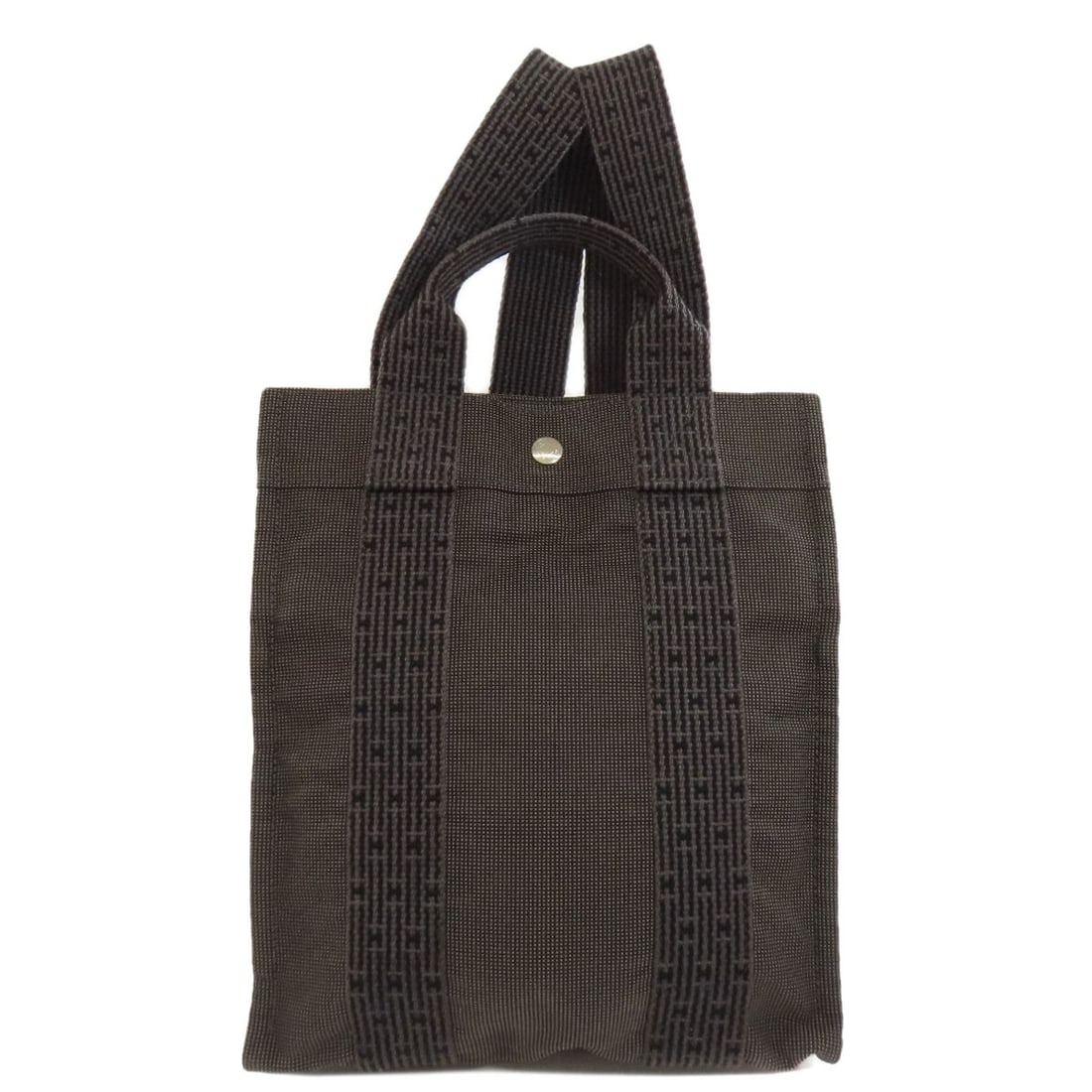 Hermes Her Line Add Pm Backpack ? Daypack Canvas: Hermes Her Line Add Pm Backpack ? Daypack Canvas Gray canvas backpack with A* daypack style, featuring a classic design. The bag's exterior bears a signature, and its gray color provides a versatile