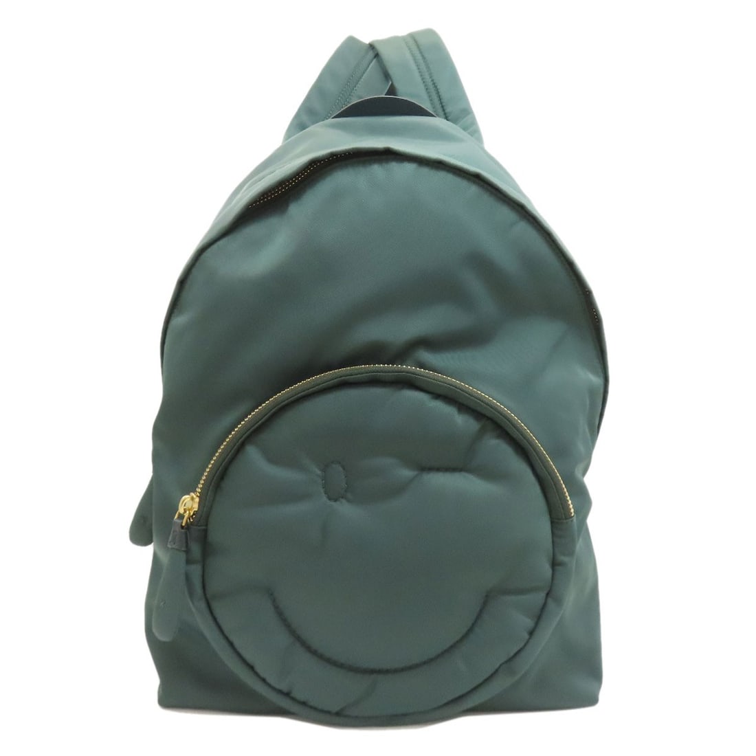 Nylon backpack smiley daypack by Anya Hindmarch: Nylon backpack smiley daypack by Anya Hindmarch The Anya Hindmarch nylon backpack smiley daypack boasts a vibrant green exterior, crafted from durable nylon material. This stylish A* Daypack features 