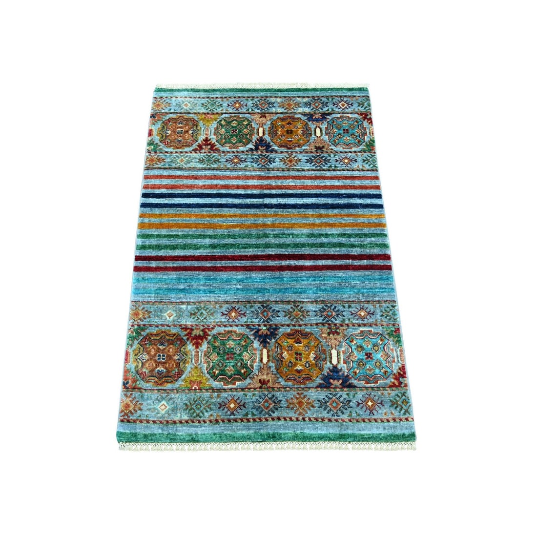 2'7"x4' Blue Afghan Super Kazak Hand Knotted Pure Wool Sample Mat Rug: 2'7"x4' Blue Afghan Super Kazak Hand Knotted Pure Wool Sample Mat Rug The Blue Afghan Super Kazak Hand Knotted Pure Wool Sample Mat Rug boasts an all-over regional design, showcasing the vibrant