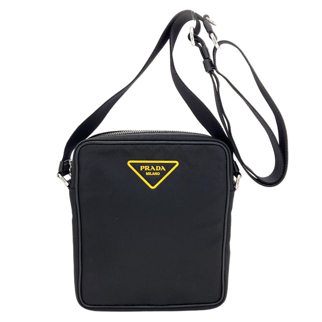 Nylon Shoulder Bag Prada Logo: Nylon Shoulder Bag Prada Logo Black nylon Prada logo shoulder bag. The bag features a black exterior made from nylon, with the iconic Prada logo prominently displayed. This stylish shoulder bag makes