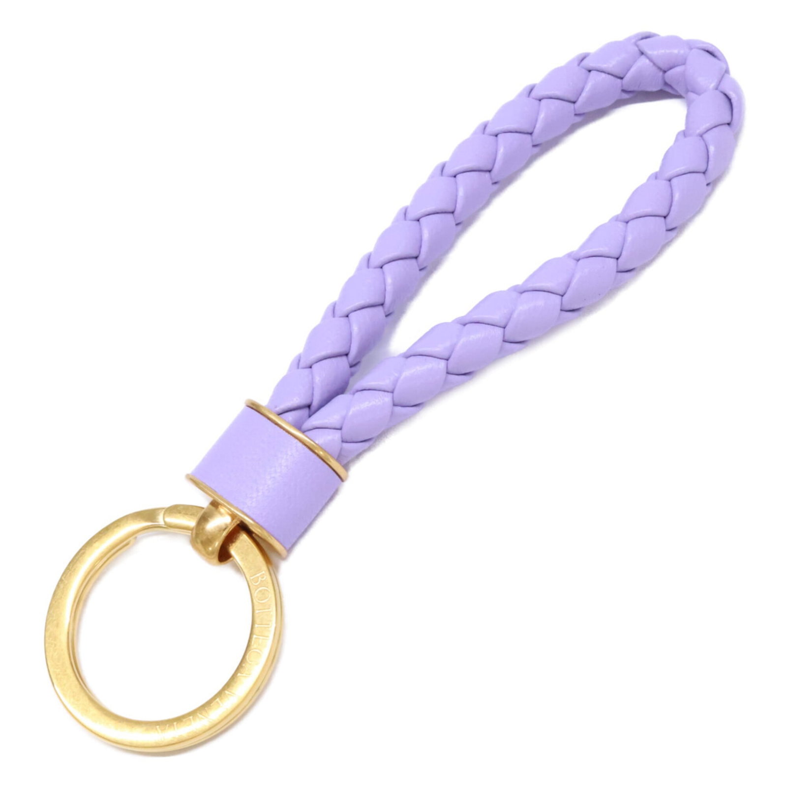 Veneta Leather Keyring: Veneta Leather Keyring Bottega Veneta's iconic leather craftsmanship shines in this elegant keyring, featuring rich gold and purple hues. Made from high-quality leather, the sleek design adds a touch 