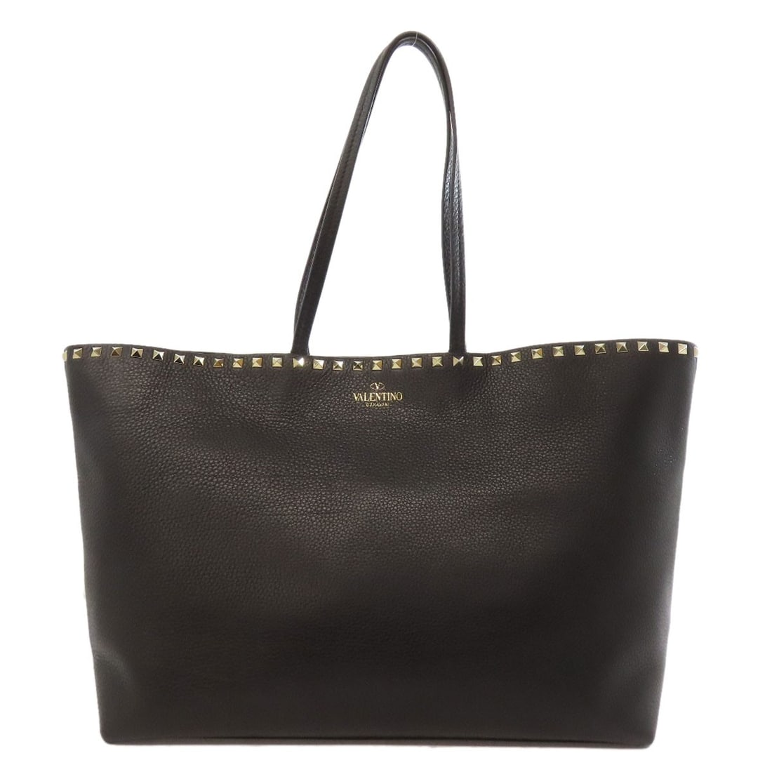 Valentino Studs Tote Bag Leather: Valentino Studs Tote Bag Leather Black leather tote bag from Valentino, featuring classic stud details. Made from high-quality leather, this stylish tote exudes sophistication and elegance. A timeless