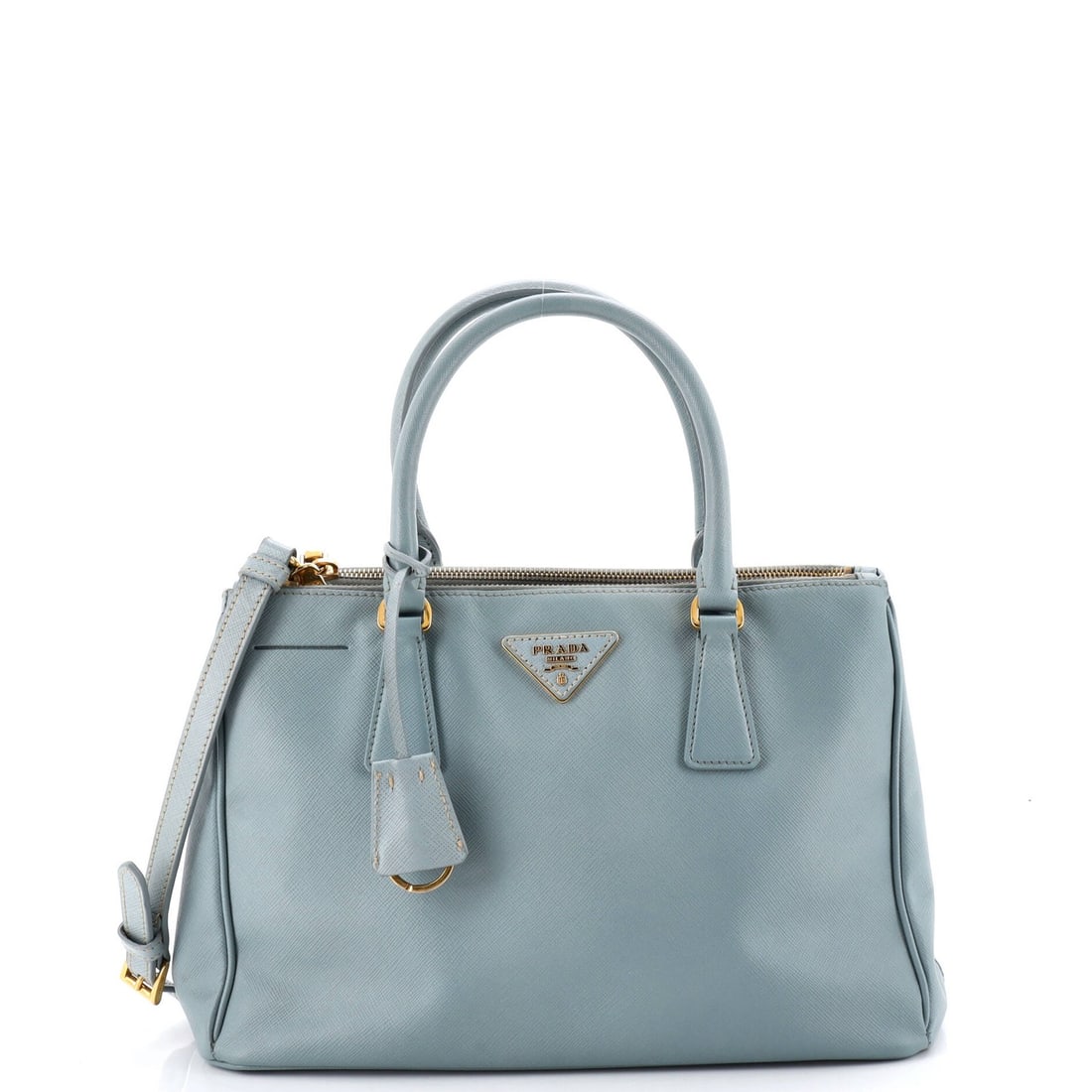 Double zip tote saffiano leather small by Prada: Double zip tote saffiano leather small by Prada Double zip tote saffiano leather small by Prada, featuring a classic blue exterior with gold hardware and a neutral interior. This stylish bag boasts a