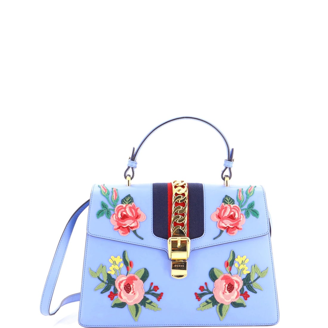 Gucci medium embroidered leather top bag handle Sylvie: Gucci medium embroidered leather top bag handle Sylvie The Gucci medium embroidered leather top bag handle Sylvie boasts a striking blue and multicolor exterior, adorned with intricate embroidery.