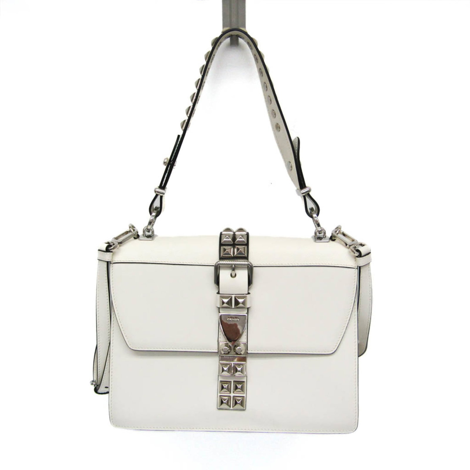 Handbag Leather Bag Shoulder Prada: Handbag Leather Bag Shoulder Prada White leather shoulder bag with Electra Studs, featuring an open pocket and zipper pocket, crafted from high-quality Italian leather. The bag boasts a sleek design