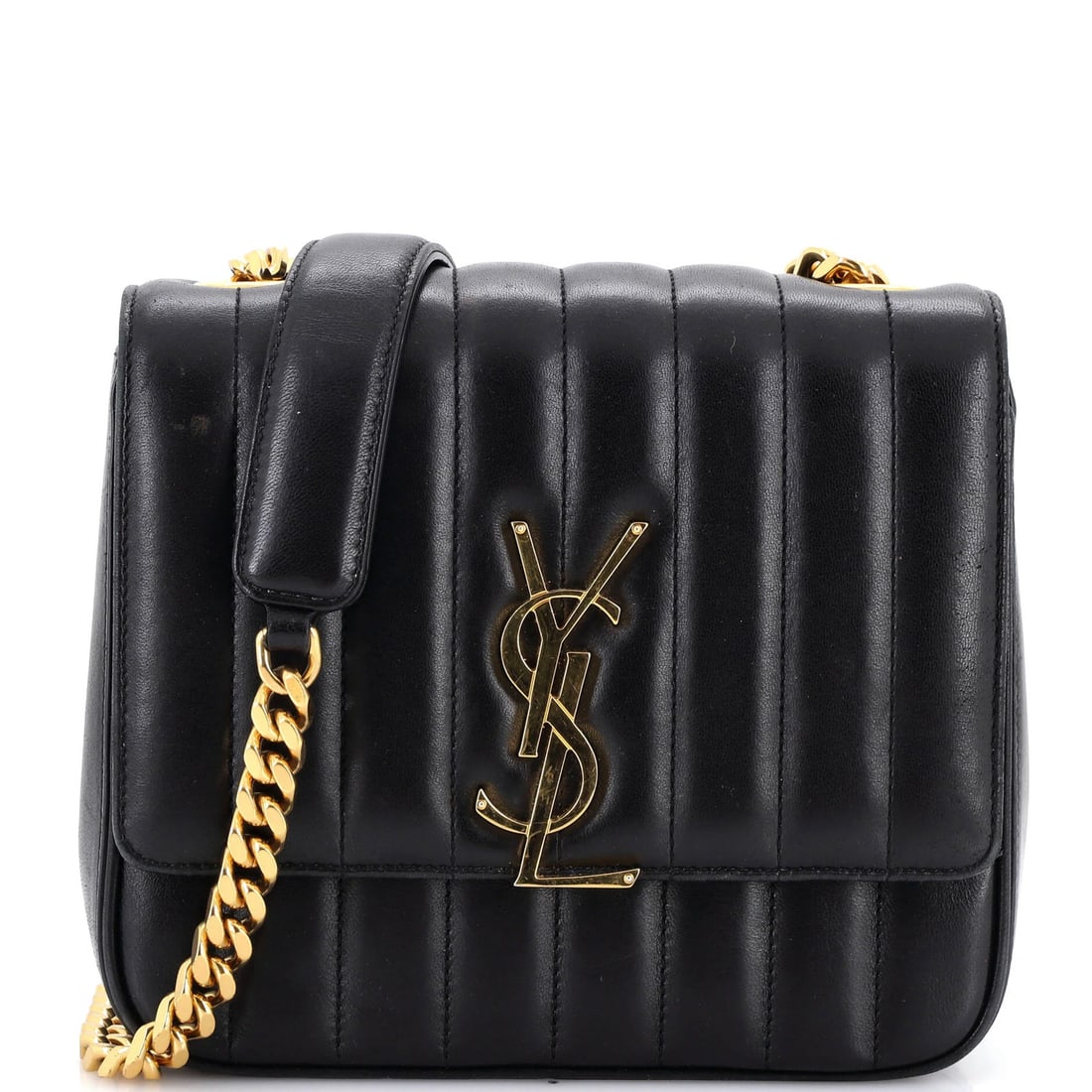 Vertical quilted leather medium crossbody bag by Saint Laurent: Vertical quilted leather medium crossbody bag by Saint Laurent The Saint Laurent Vicky Crossbody Bag boasts a striking vertical quilted leather design, adding an edgy touch to its sleek black