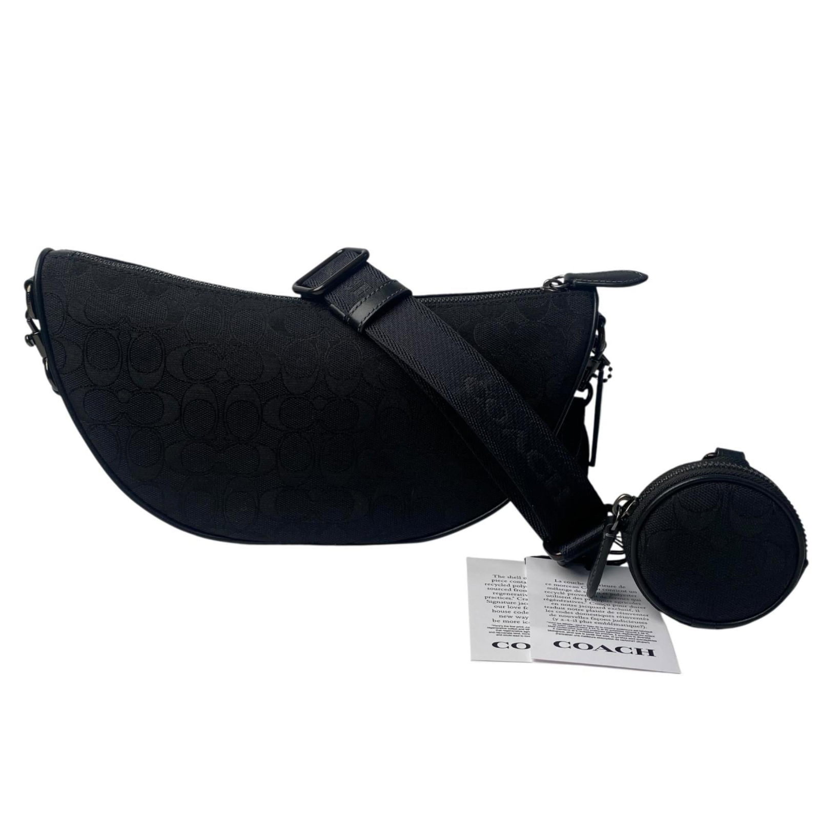 Canvas shoulder bag coach: Canvas shoulder bag coach Canvas shoulder bag with sleek black design, measuring 14cm x 18cm x 10cm. Comes with dust bag and pouch for added protection, along with a sturdy shoulder strap for
