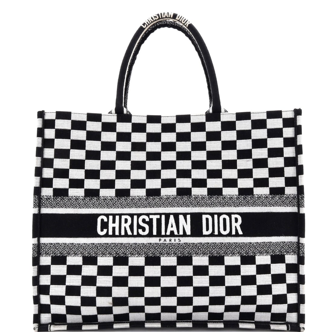 Christian Dior Book Large Canvas Embroidered Tote: Christian Dior Book Large Canvas Embroidered Tote Black canvas tote bag with embroidered design, measuring 13.5" high and 16" wide, featuring a signature on the front. The bag has some edge wear, corn