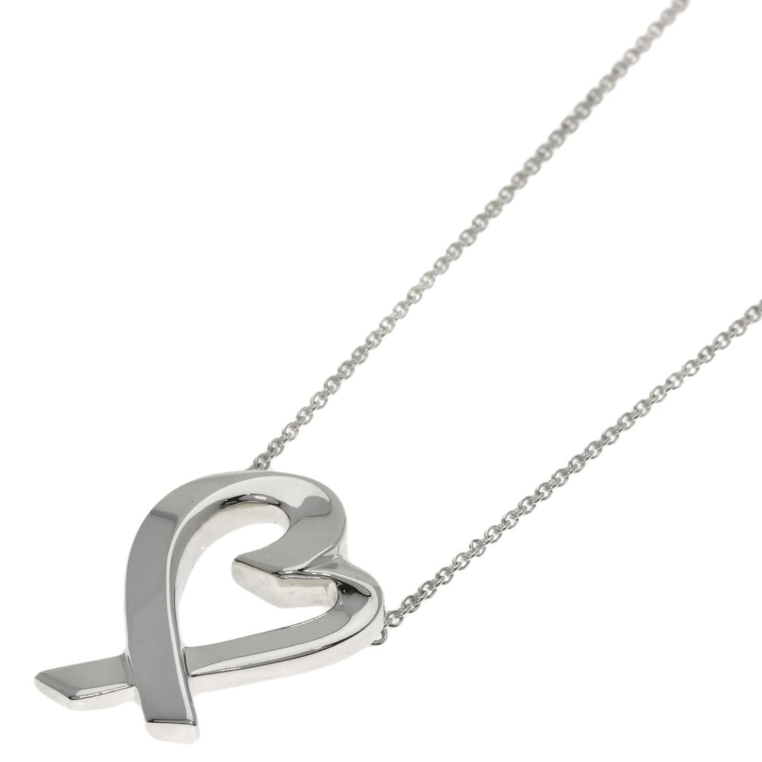 Loving Heart of Tiffany Co. Silver: Loving Heart of Tiffany Co. Silver Lovely Tiffany Co. silver necklace with a delicate design, featuring a striking silver finish and a length of 18.5 inches. This elegant piece showcases the iconic st