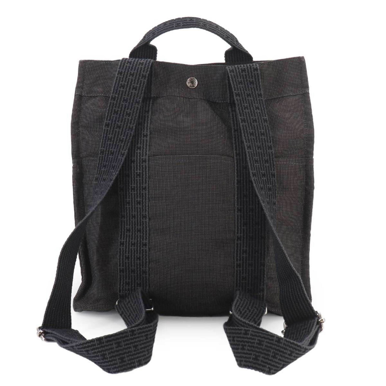 Canvas Backpack Hermes: Canvas Backpack Hermes Canvas Backpack in Gray from Hermes, France. This stylish canvas backpack measures 35cm x 31cm x 12cm and features a classic design with clean lines. The gray color adds a