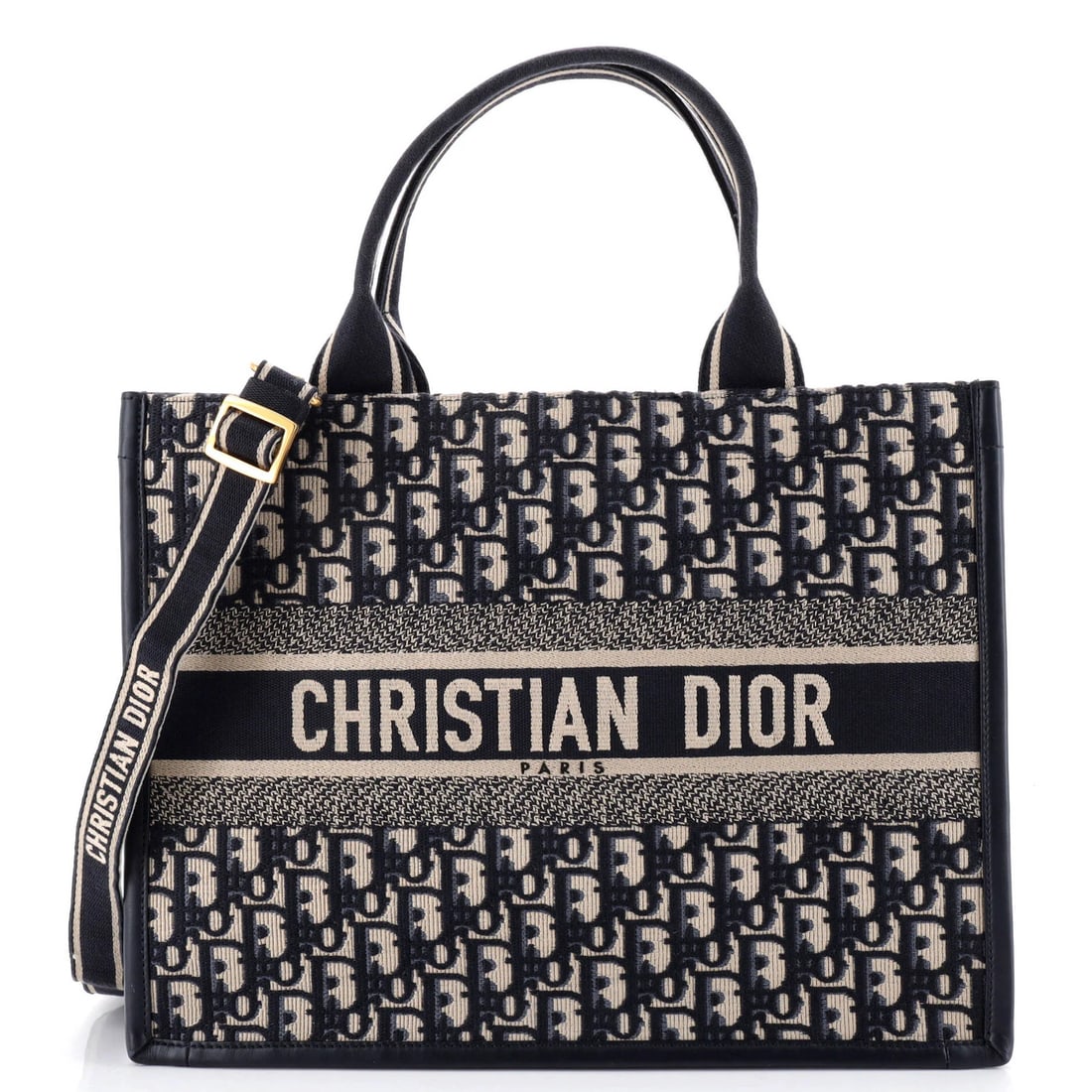 Book Tote Strap Dior Oblique Christian Medium Canvas: Book Tote Strap Dior Oblique Christian Medium Canvas Blue canvas tote bag with leather strap, featuring the iconic Oblique pattern from Christian Dior's Book Tote collection. Measuring 11" x 14" x