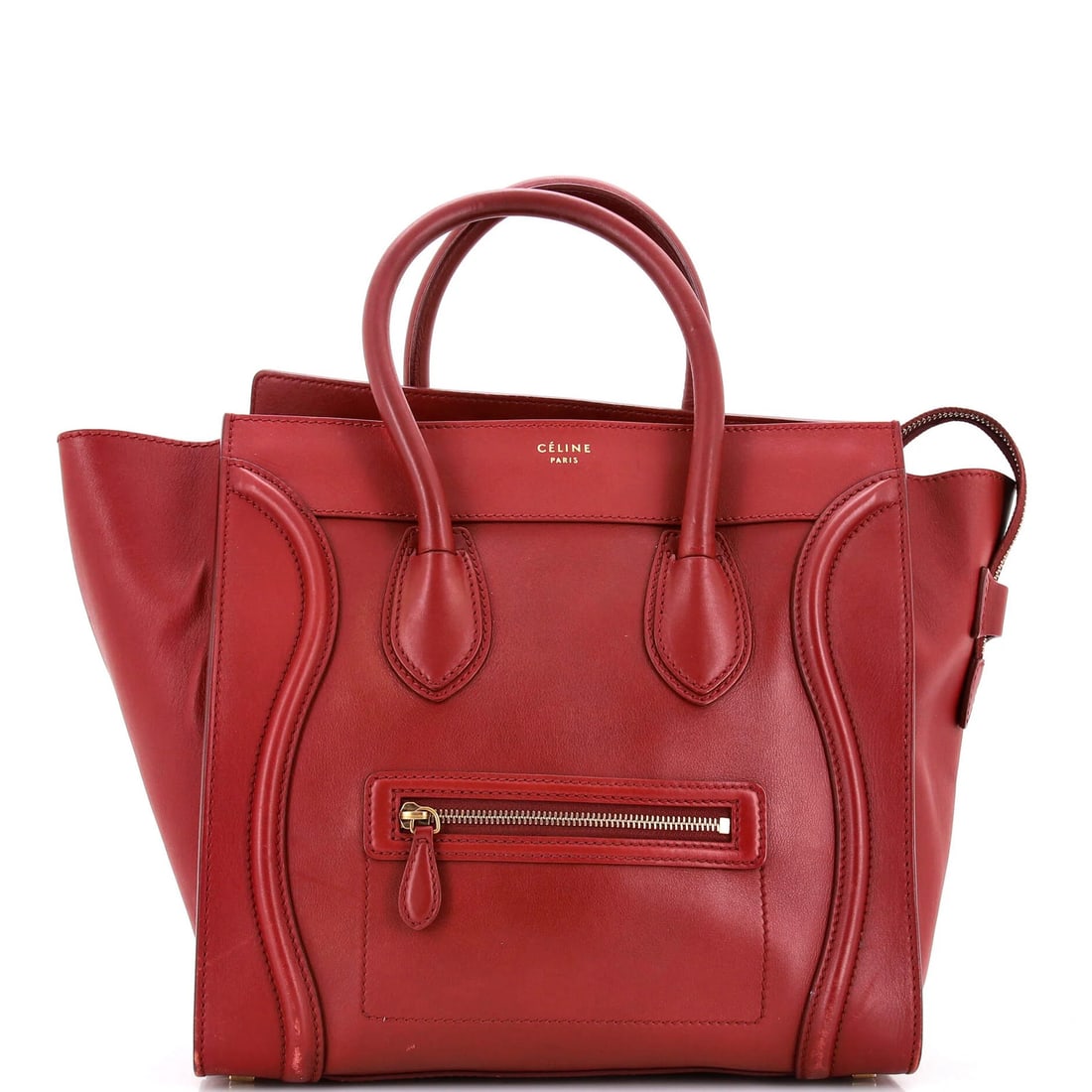 Celine Luggage Bag Smooth Leather Mini: Celine Luggage Bag Smooth Leather Mini Smooth leather exterior in vibrant red, the Celine Luggage Bag Mini boasts sleek design and classic style. With its signature gold hardware and sturdy constructi
