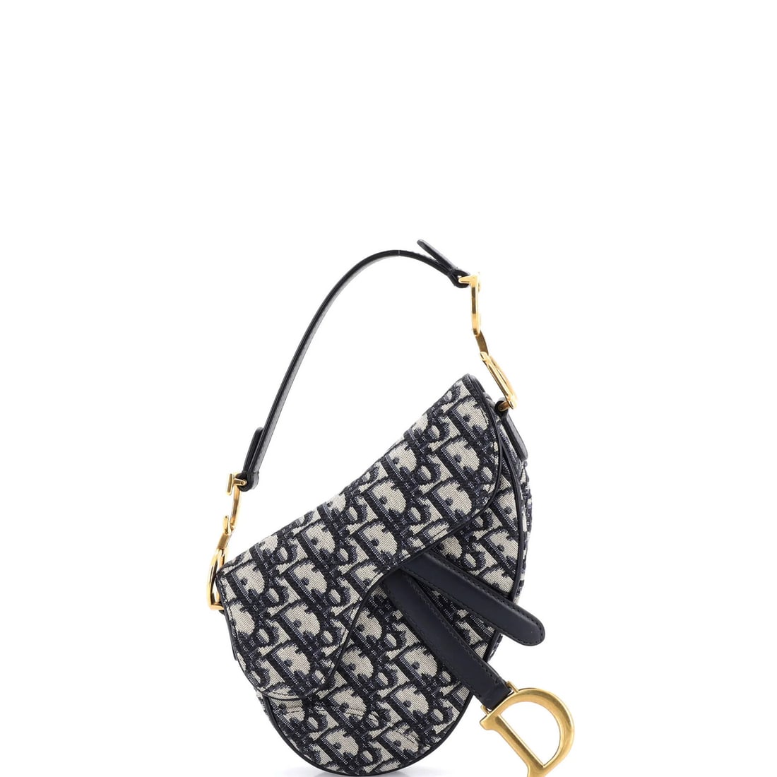 Handbag Saddle Canvas Oblique Dior Christian Mini: Handbag Saddle Canvas Oblique Dior Christian Mini The Christian Dior Saddle Canvas Oblique Mini Handbag features a striking blue canvas exterior with an oblique design, classic shoulder straps, and
