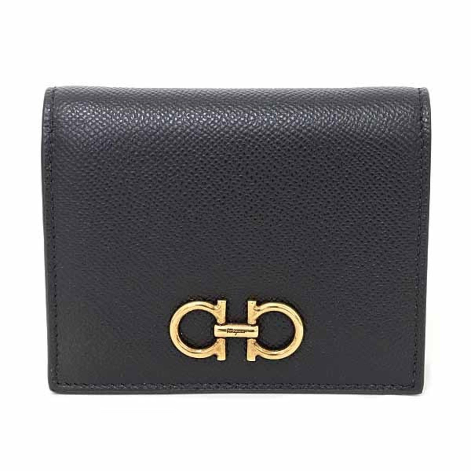 Salvatore Ferragamo Wallet (Bi-Fold) Leather: Salvatore Ferragamo Wallet (Bi-Fold) Leather Salvatore Ferragamo bi-fold leather wallet in black calfskin, presented in its original box. This Italian-made wallet features classic design and premium