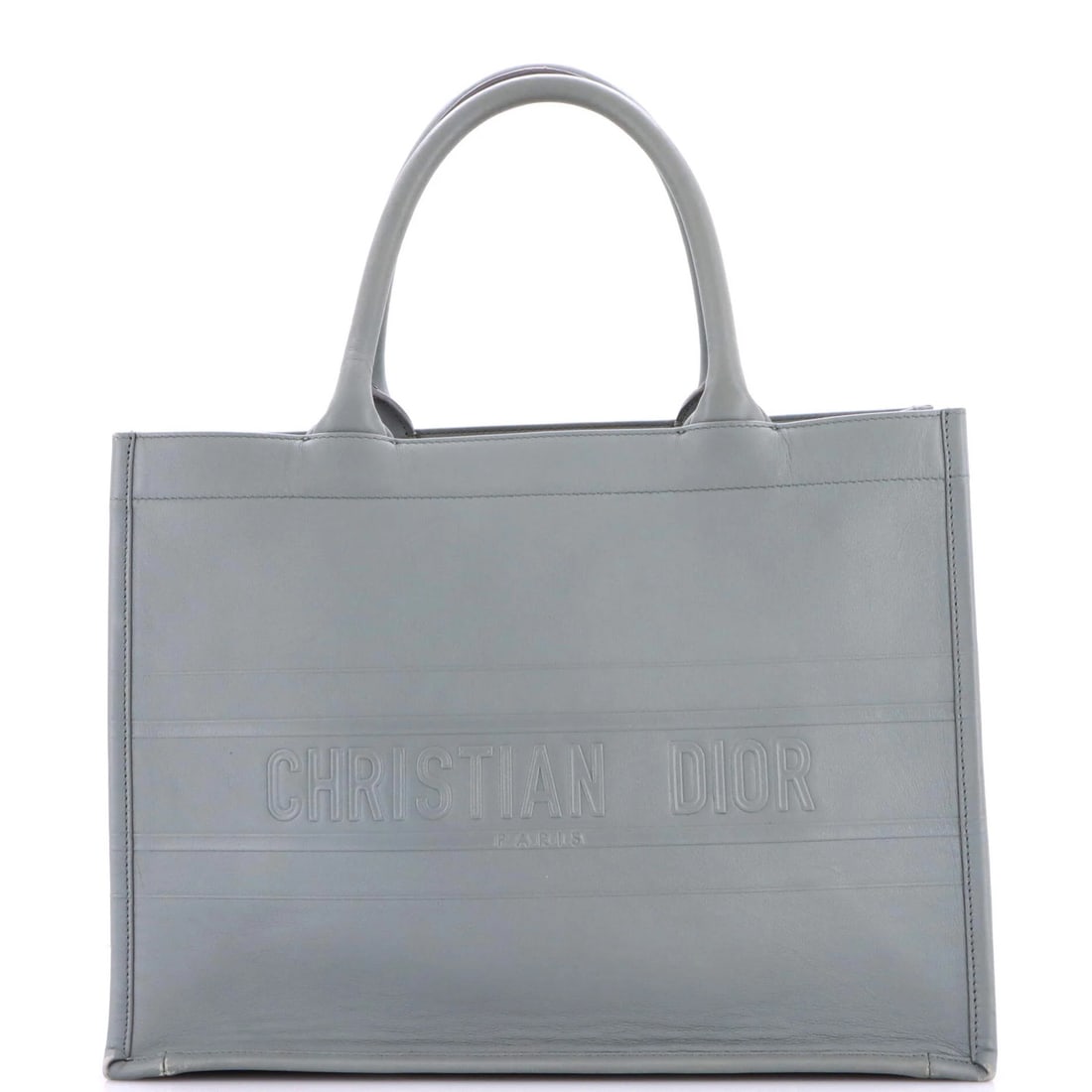Christian Dior Book Tote Oblique Embossed Calfskin Medium: Christian Dior Book Tote Oblique Embossed Calfskin Medium The Christian Dior Book Tote Oblique Embossed Calfskin Medium features a classic design with an oblique embossed pattern on the exterior, addi