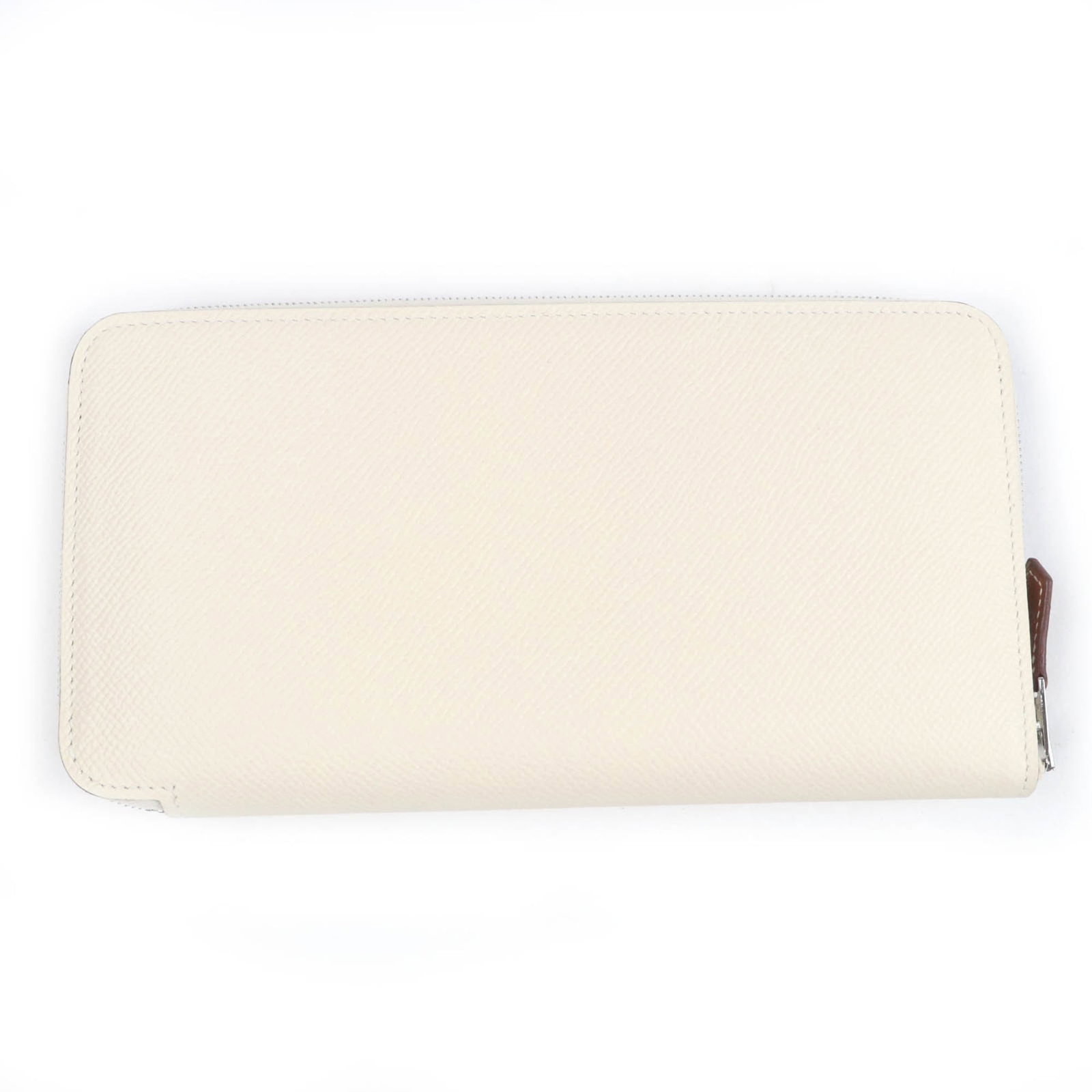 Long Wallet Bi Fold Epsom Leather: Long Wallet Bi Fold Epsom Leather Epsom leather craftsmanship meets modern design in this long bi-fold wallet, featuring a zip closure and multiple slots for organization. The sturdy construction ensu