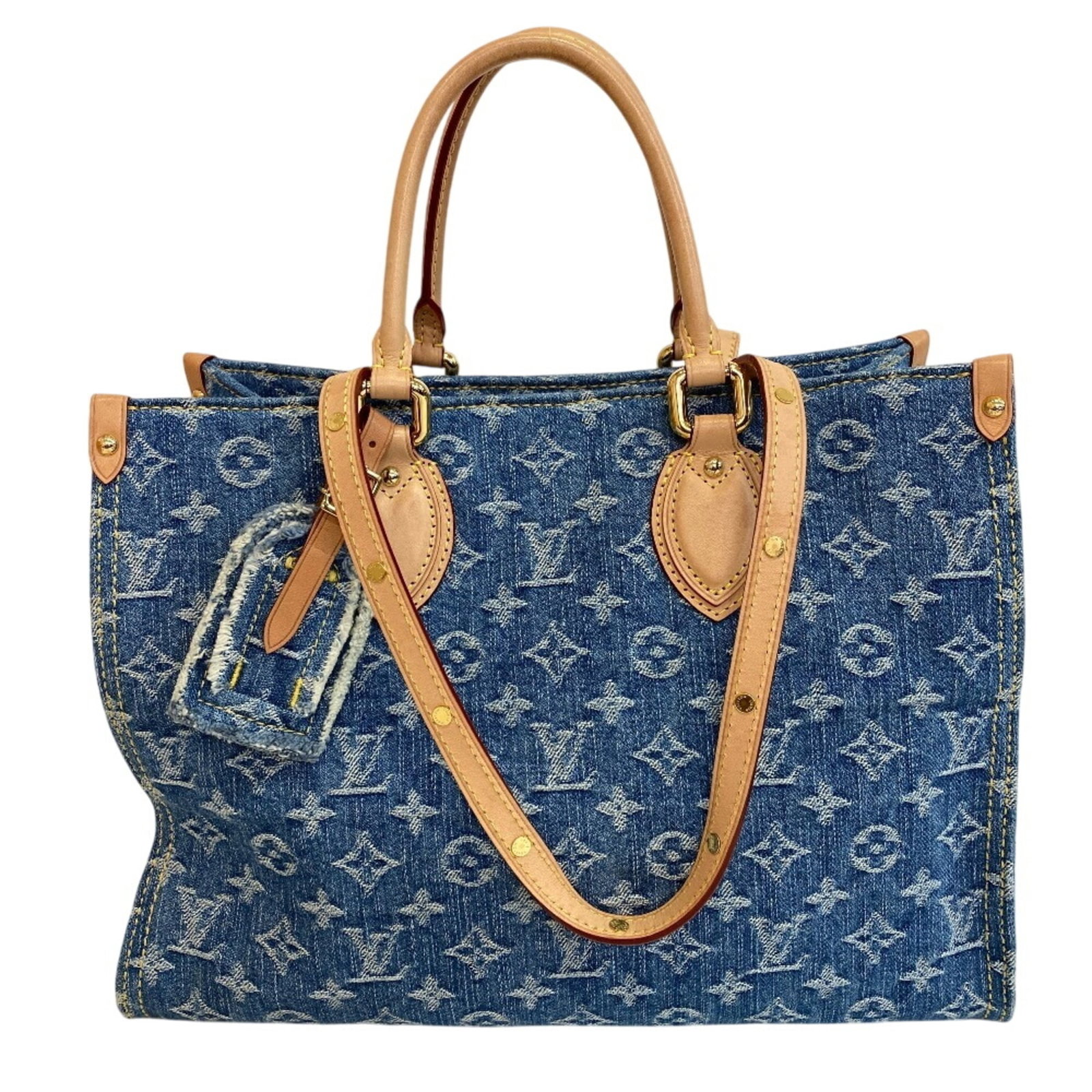 Shoulder bag tote leather monogram denim Louis Vuitton: Shoulder bag tote leather monogram denim Louis Vuitton Monogram denim and leather come together in this classic Louis Vuitton shoulder bag tote, featuring the iconic monogram pattern. Made from