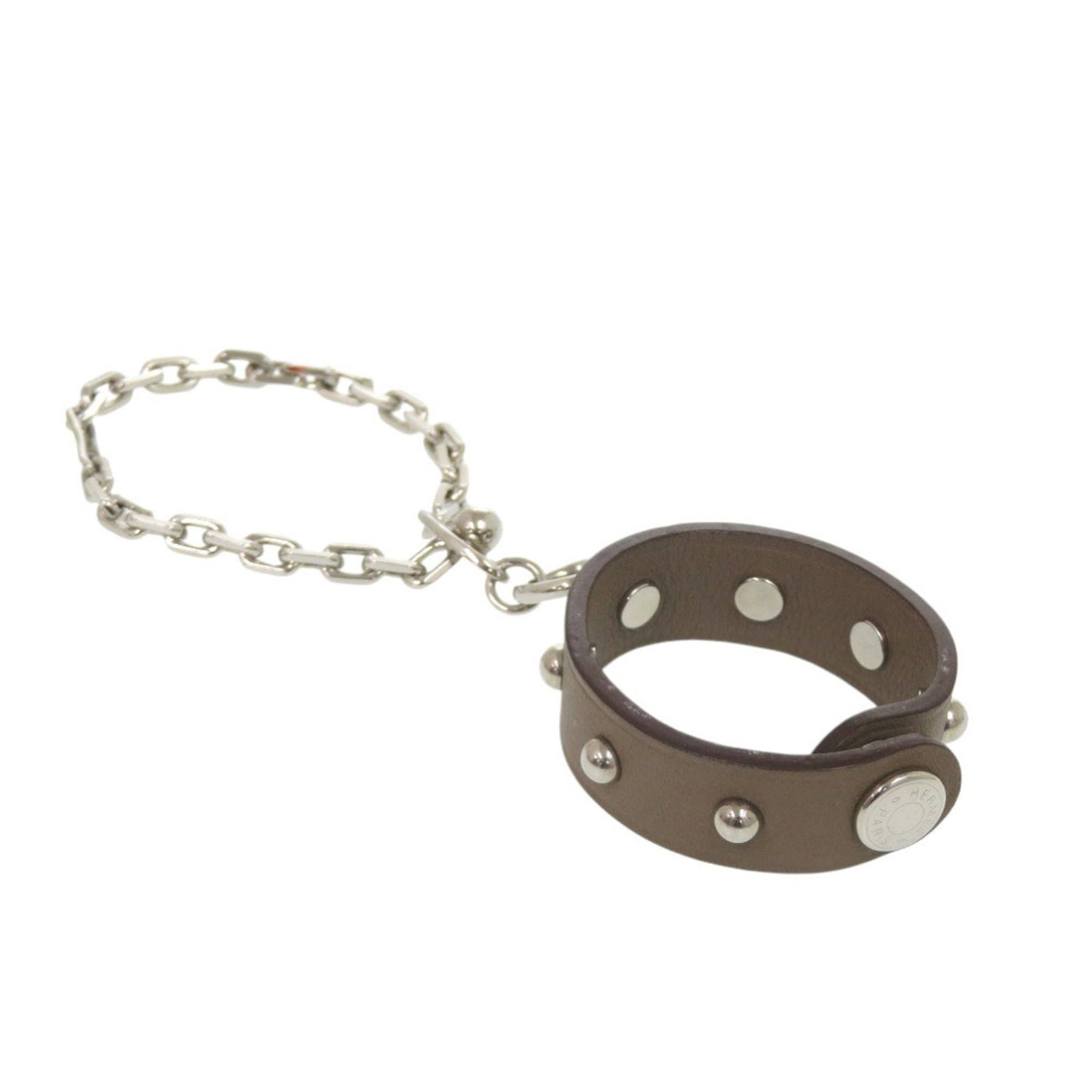 Swift leather glove holder Hermes: Swift leather glove holder Hermes Swift leather glove holder from Hermes, featuring etoupe gray color and swift leather material. This compact accessory measures 12.3cm x 1.2cm x 4.84'' x 0.47'' and