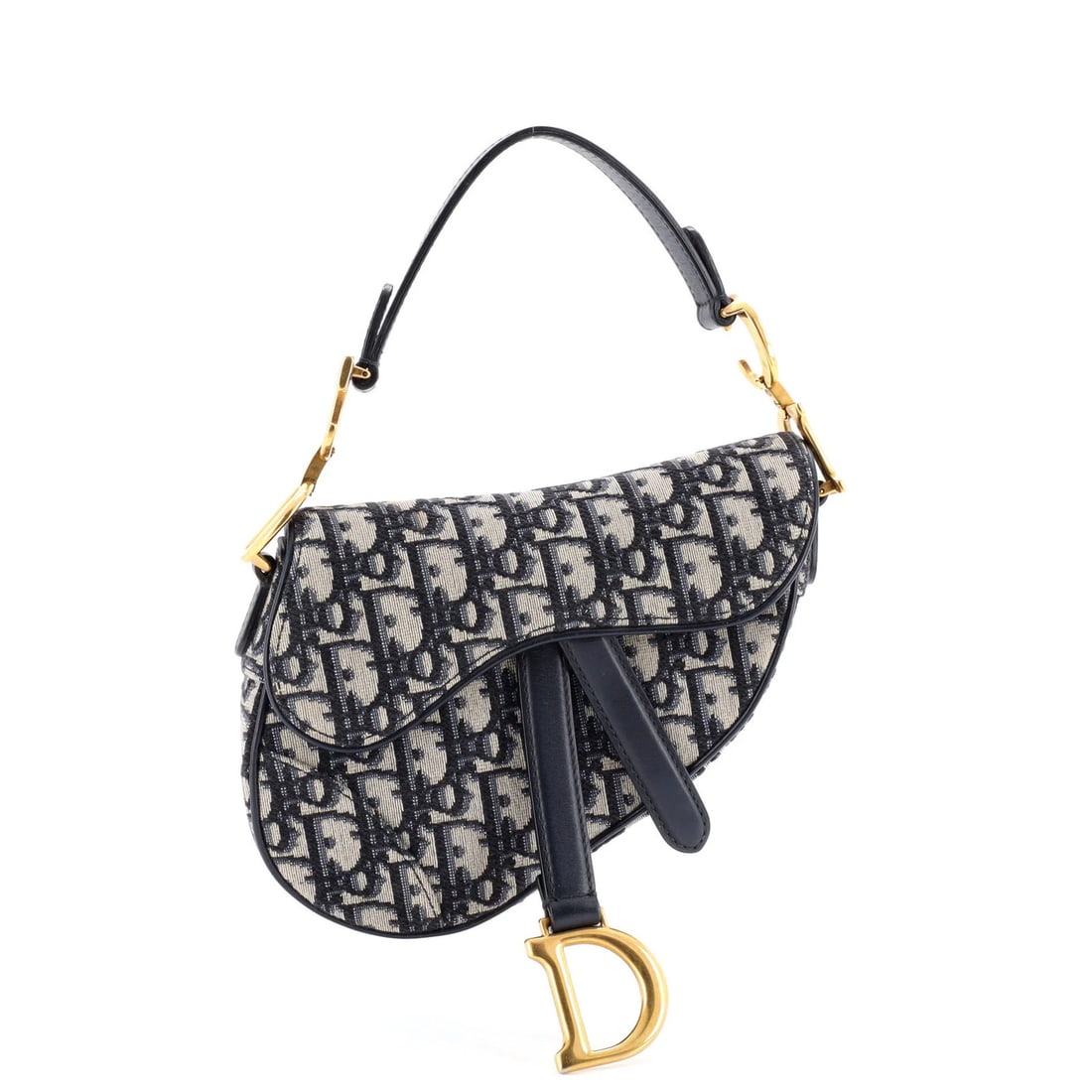 Handbag Saddle Canvas Oblique Dior Christian Mini: Handbag Saddle Canvas Oblique Dior Christian Mini The Christian Dior Saddle Canvas Oblique Mini Handbag features a striking blue canvas exterior with an oblique design, classic shoulder straps, and ne