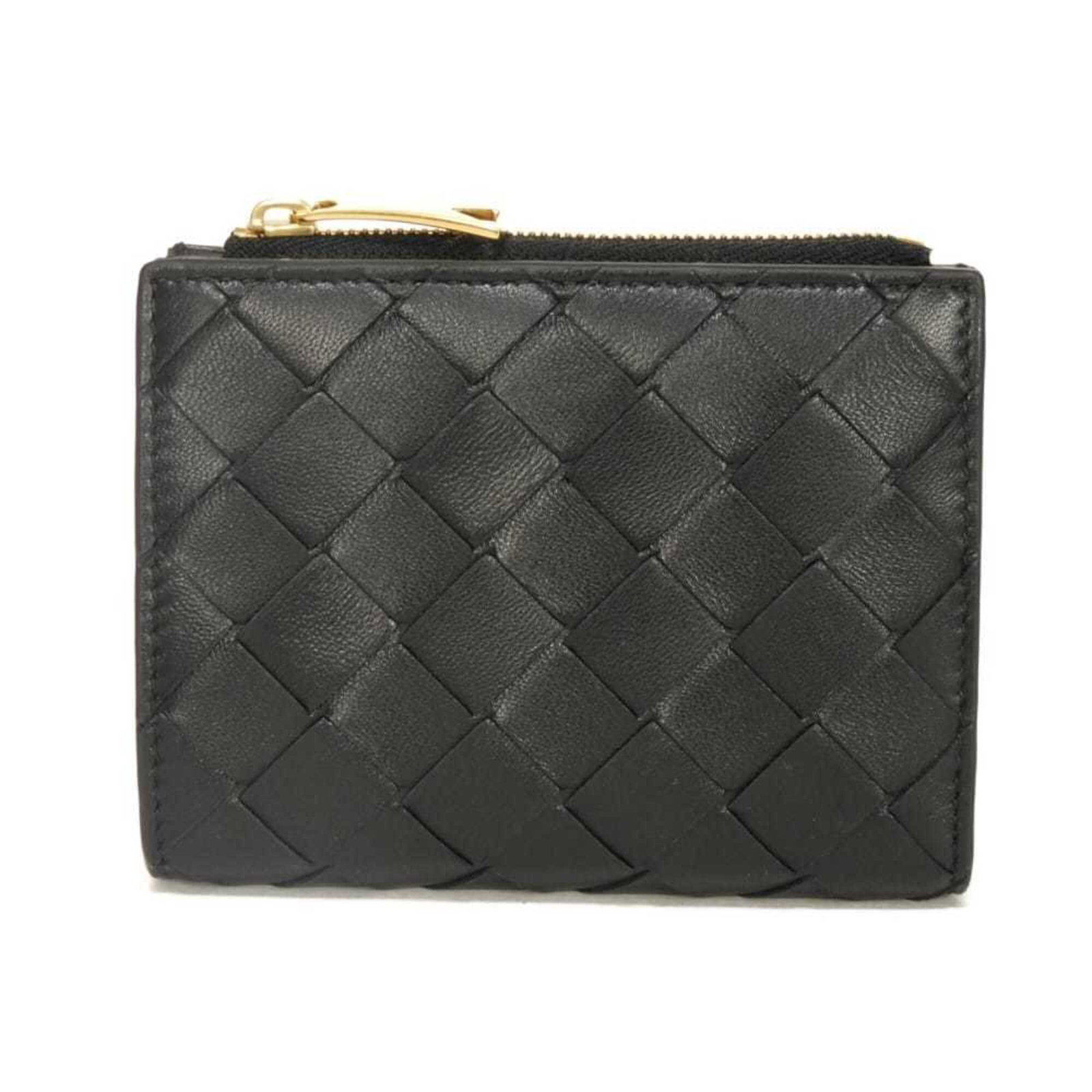 Intrecciato Wallet Bi Fold Bottega: Intrecciato Wallet Bi Fold Bottega Intrecciato Wallet Bi Fold Bottega - A sleek and sophisticated accessory, this bi-fold wallet features the signature Intrecciato weave pattern in black. Made from hi